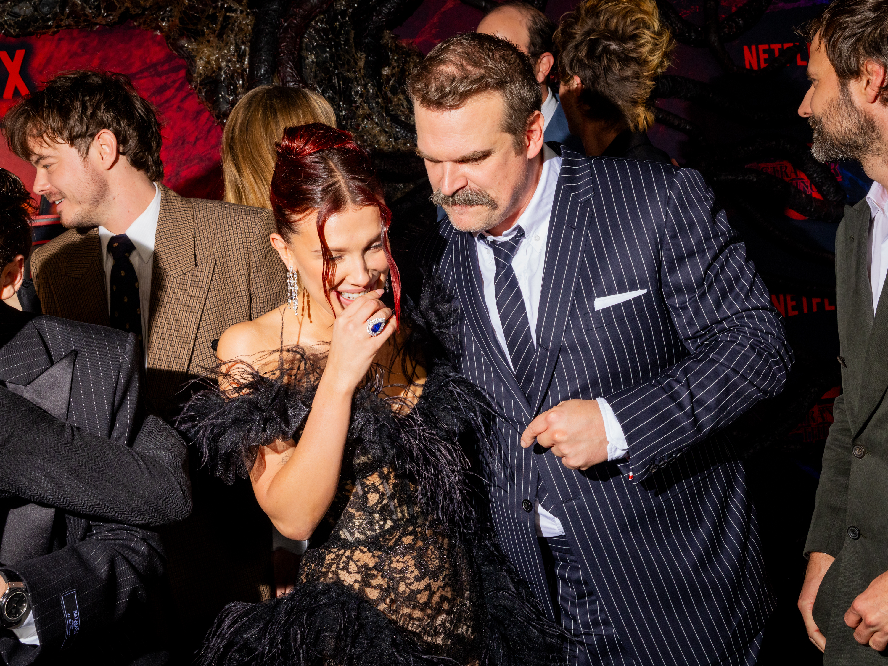 HOLLYWOOD, CALIFORNIA - NOVEMBER 06: (L-R) Charlie Heaton, Millie Bobby Brown, and David Harbour attend Netflix's