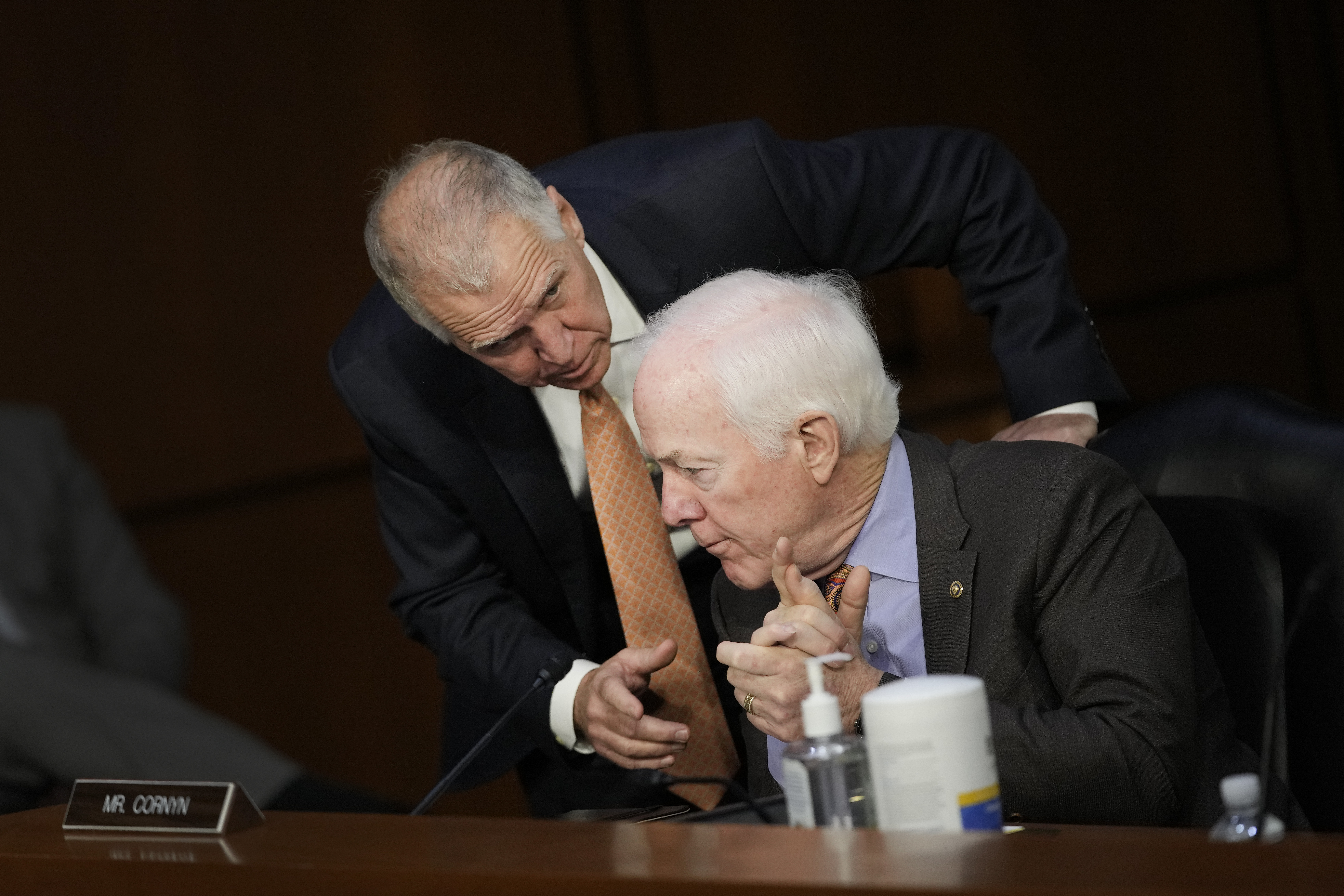 WASHINGTON, DC - MARCH 23: (L-R) Sen. Thom Tillis (R-NC) talks to Sen. John Cornyn (R-TX) as U.S. Supreme Court nominee Judge Ketanji Brown Jackson testifies during her Senate Judiciary Committee confirmation hearing in the Hart Senate Office Building on Capitol Hill, March 23, 2022 in Washington, DC. Judge Ketanji Brown Jackson, President Joe Biden’s pick to replace retiring Justice Stephen Breyer on the U.S. Supreme Court, would become the first Black woman to serve on the Supreme Court if confirmed. (Photo by Drew Angerer/Getty Images)
