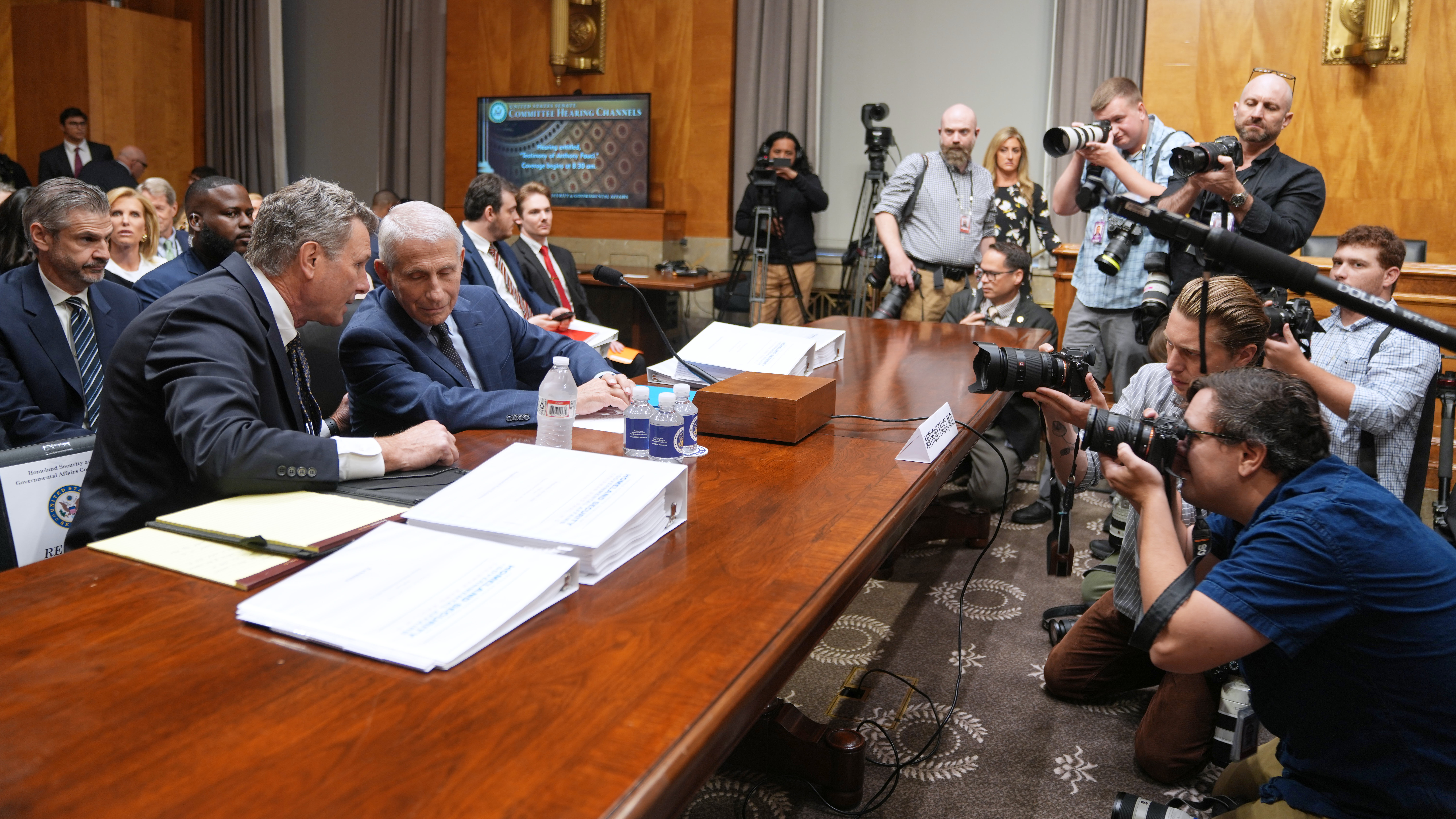 Dr. Anthony Fauci, left, arrives to appear before the Senate Homeland Security and Governmental Affairs Committee at the Capitol, Wednesday, July 29, 2026, in Washington. (AP Photo/Allison Robbert)