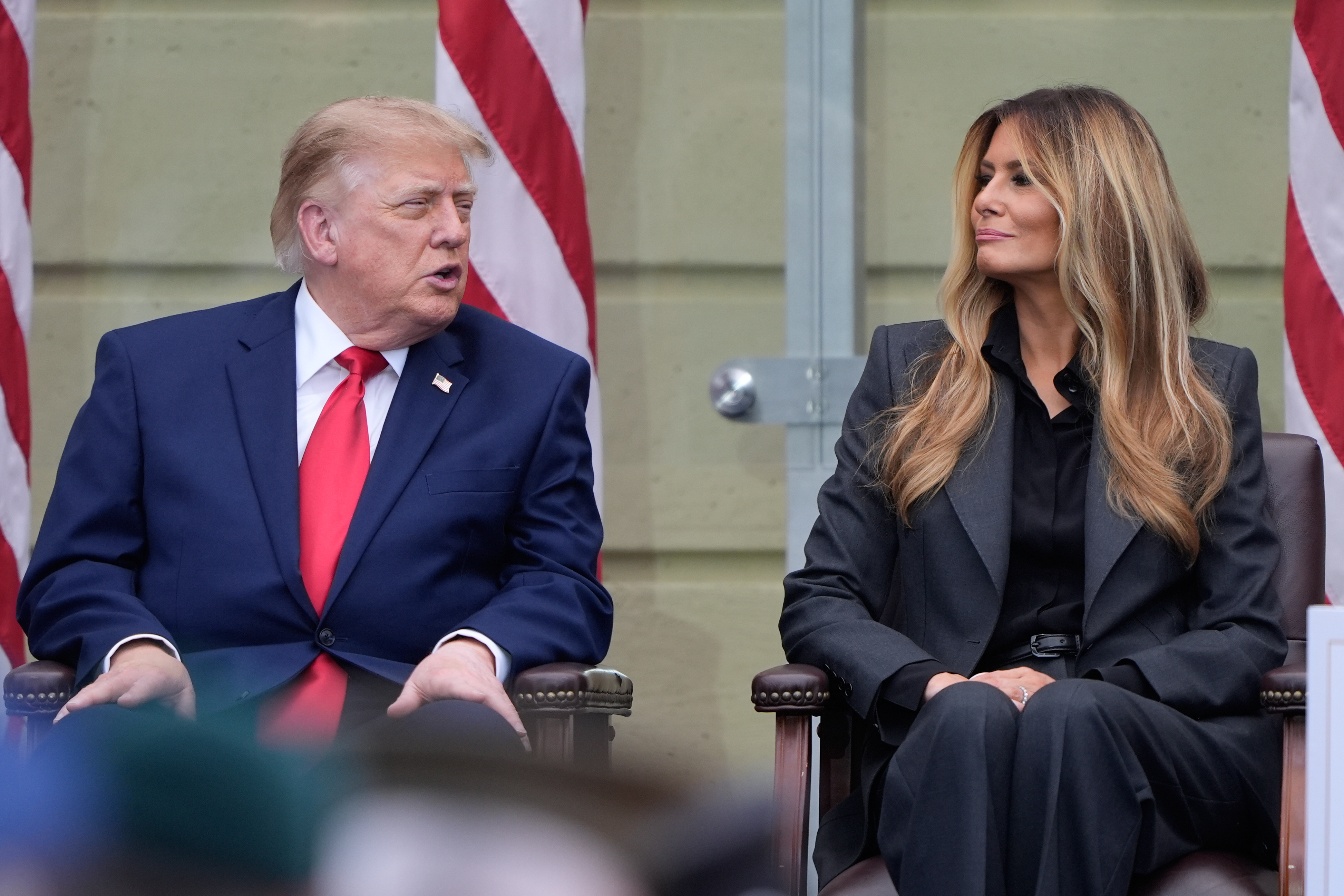 President Donald Trump talks with first lady Melania Trump, as they attend a ceremony to commemorate the 25th anniversary of the 9/11 attacks at the Pentagon, Friday, Sept. 11, 2026, in Washington. (AP Photo/Manuel Balce Ceneta)