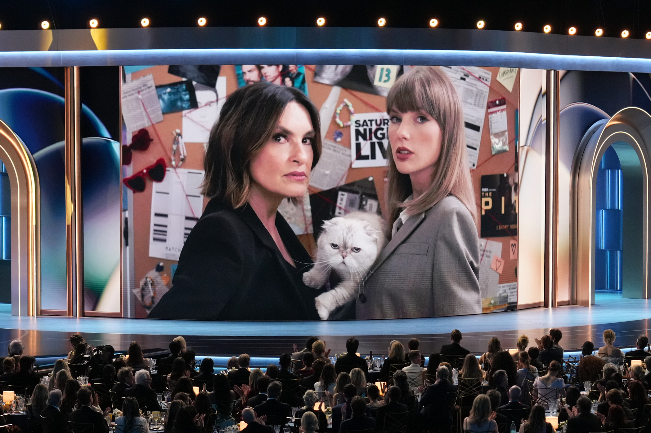 Host Mariska Hargitay left, and Taylor Swift in a