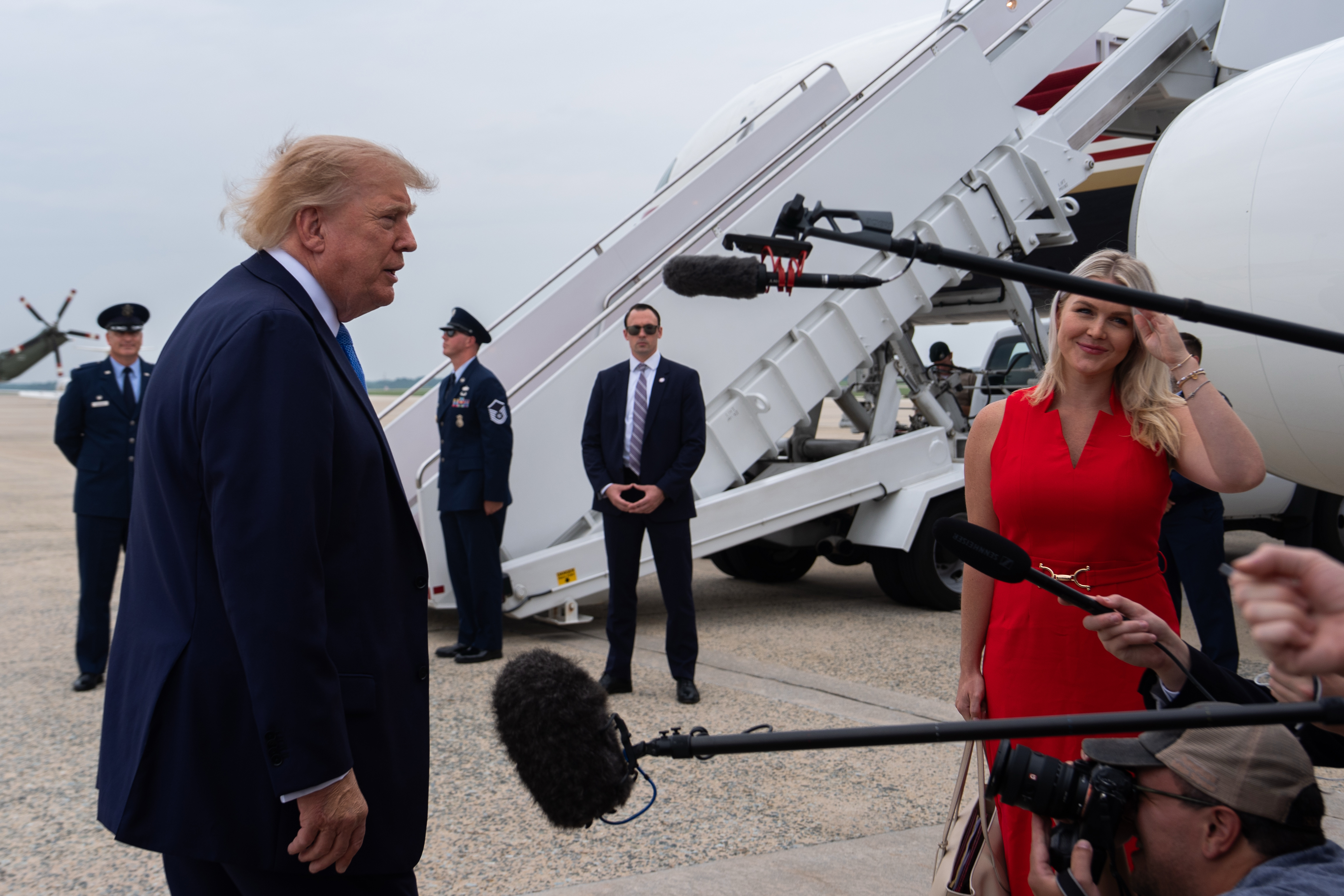 President Donald Trump speaks with reporters before boarding Air Force One, Friday, Aug. 14, 2026, at Joint Base Andrews, Md. (AP Photo/Julia Demaree Nikhinson)