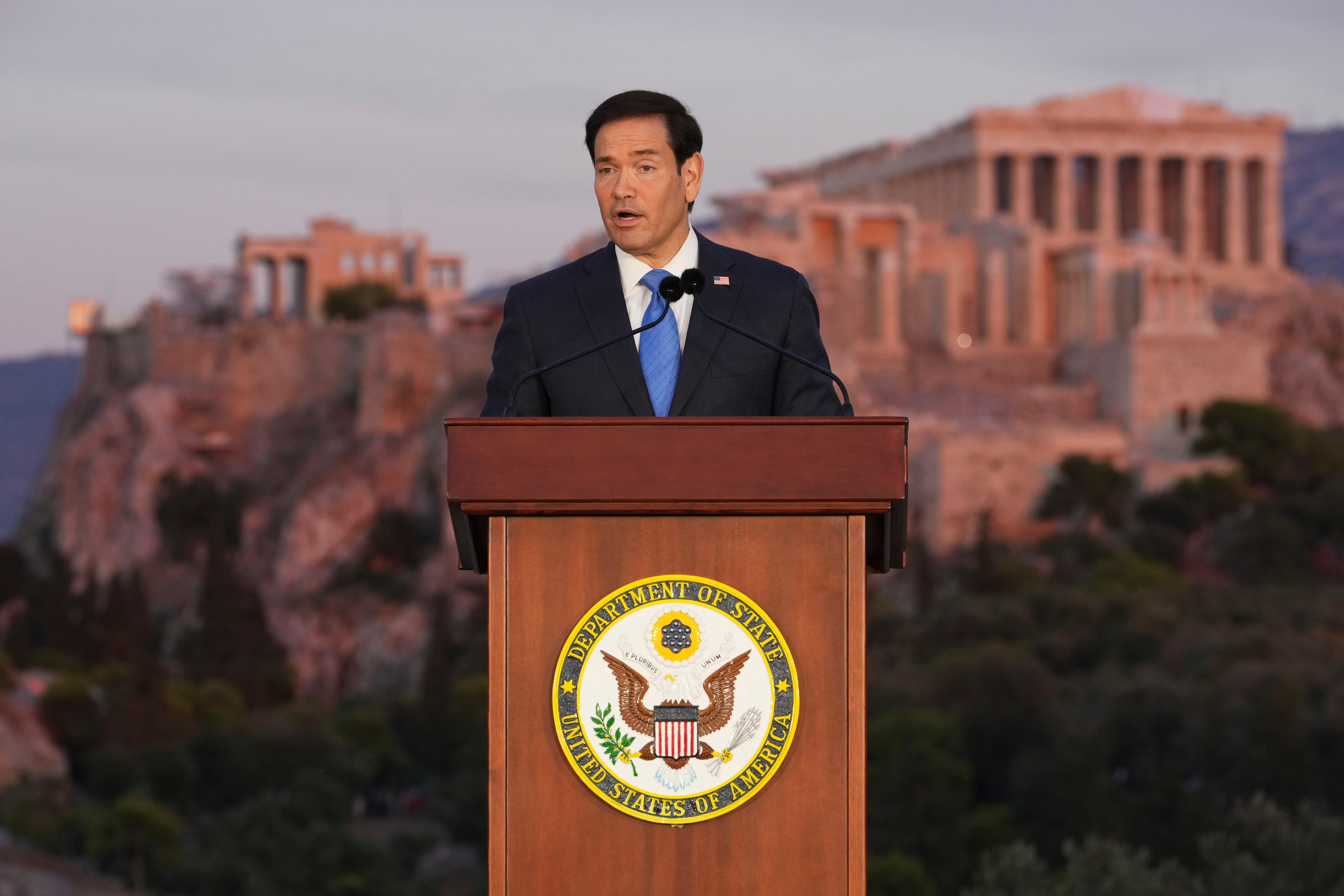 Secretary of State Marco Rubio speaks at the Pnyx hill, where ancient Athenians held democratic assemblies, with the ancient Parthenon temple atop the Acropolis in the background, in Athens,Wednesday, Oct 7, 2026 (AP Photo/Mark Schiefelbein, Pool)