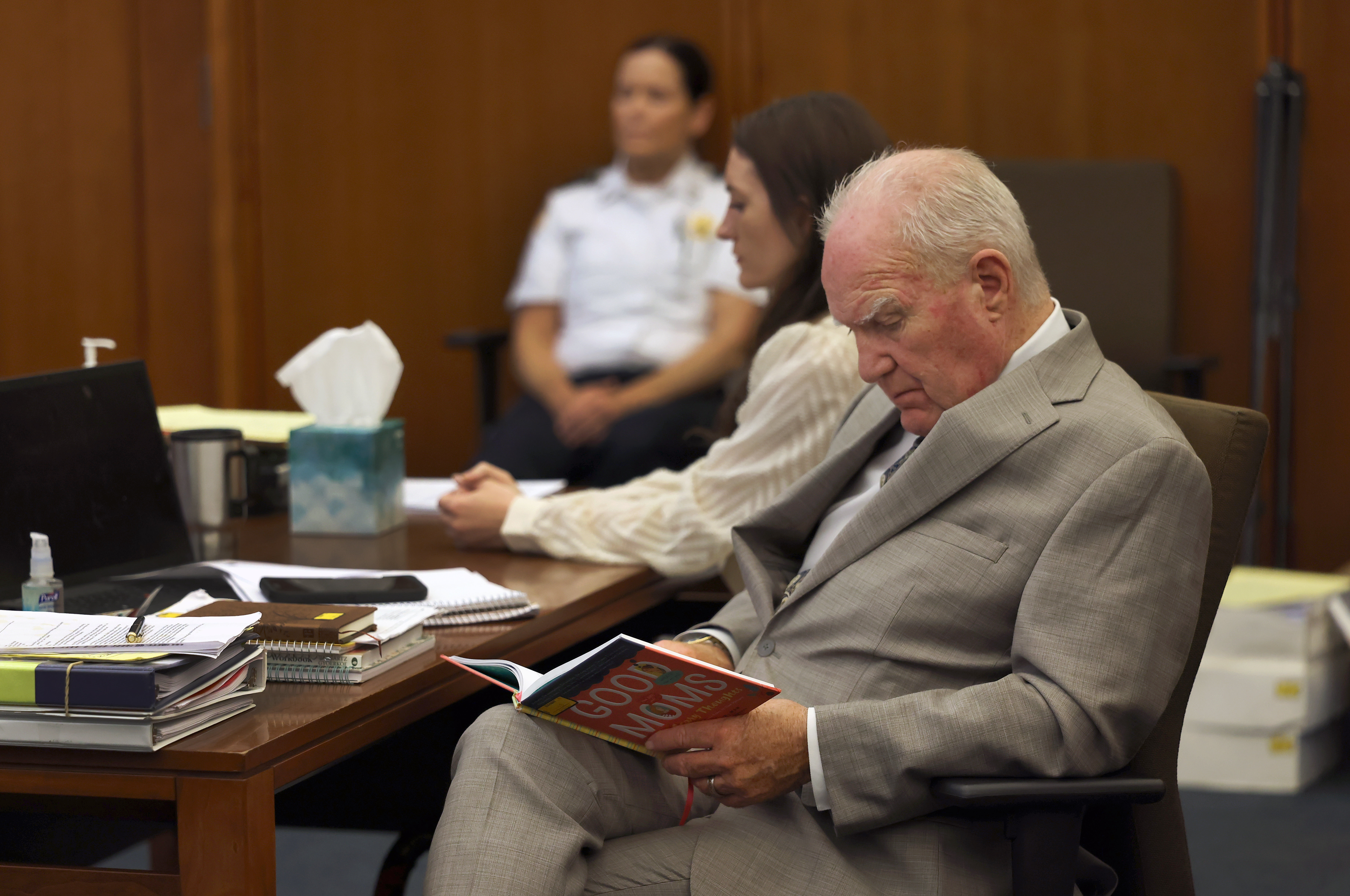 Lindsay Clancy sits in court as her defense attorney Kevin Reddington looks over a children's book marked as an exhibit during her murder trial at Plymouth Superior Court in Plymouth, Mass., Wednesday, Aug. 5, 2026. (David L Ryan/The Boston Globe via AP, Pool)