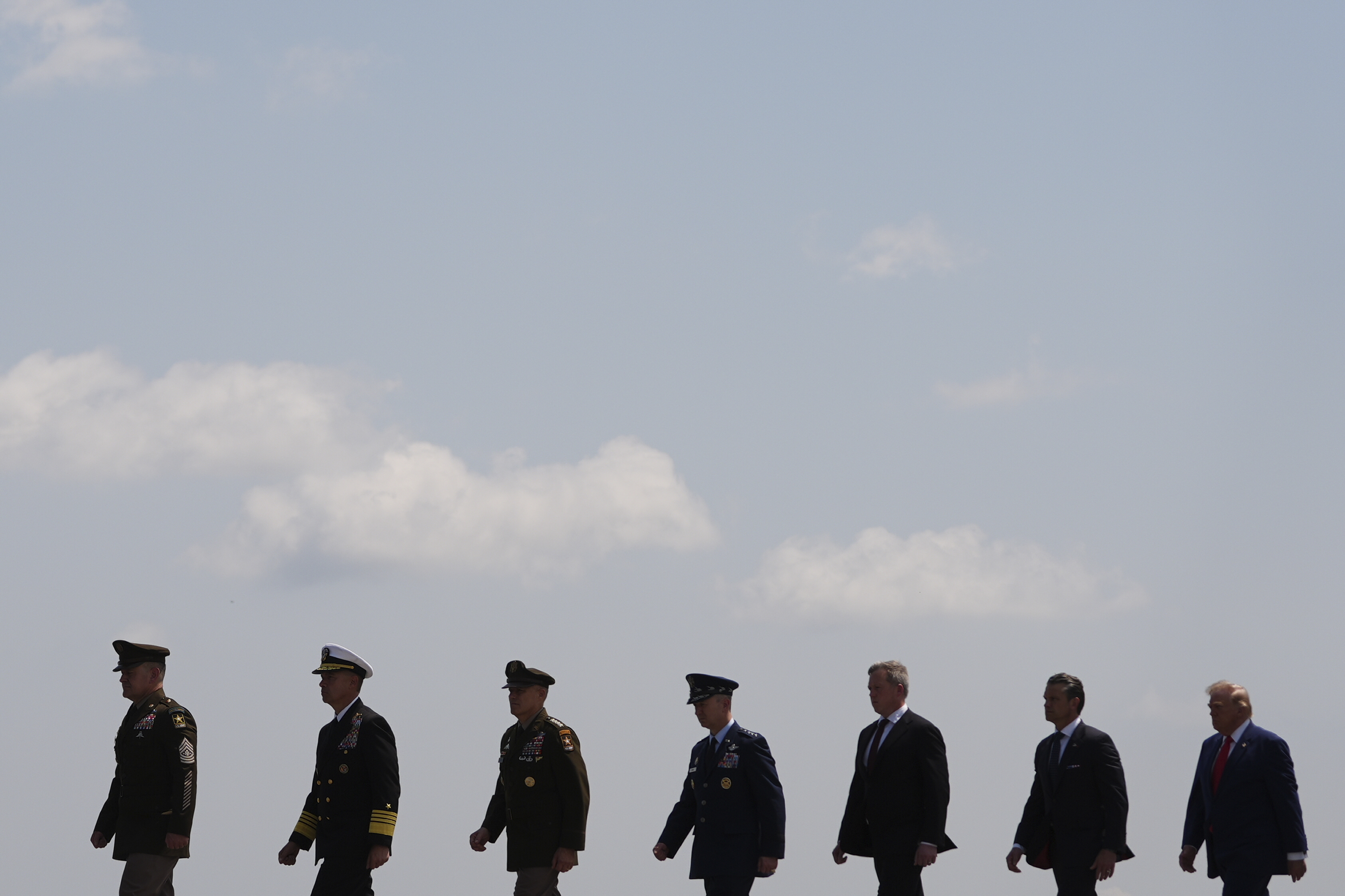 President Donald Trump, far right, and Defense Secretary Pete Hegseth, second from right, attend the dignified transfer of four U.S. service members recently killed in the Middle East, Wednesday, July 22, 2026, at Dover Air Force Base, Del. (AP Photo/Julia Demaree Nikhinson)