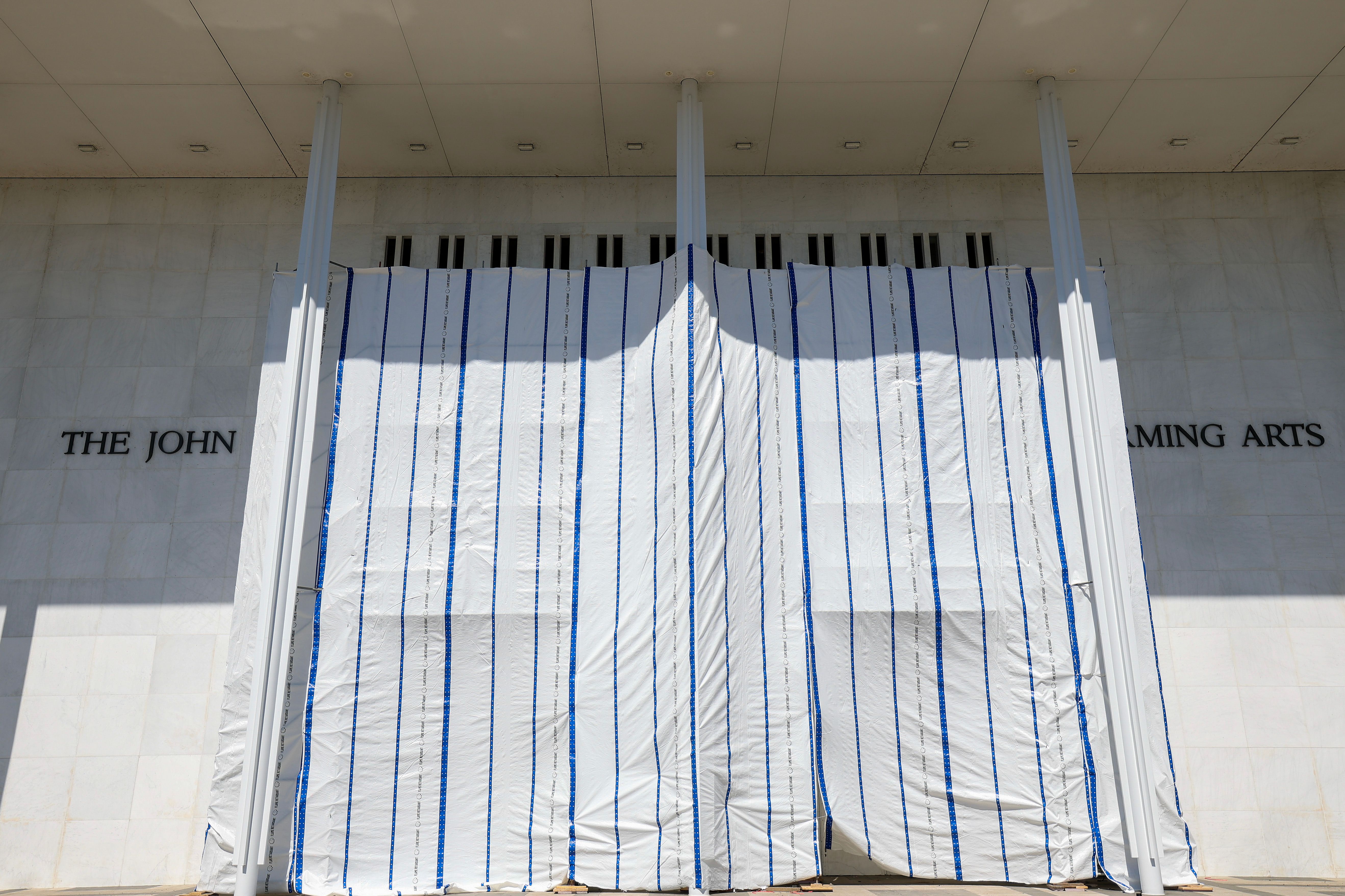 WASHINGTON, DC - JUNE 13: Tarps are hung on scaffolding outside The Kennedy Center on June 13, 2026 in Washington, DC. Friday late night workers removed the President Donald Trump's name from the Kennedy Center. (Photo by Tasos Katopodis/Getty Images)(Photo by Tasos Katopodis/Getty Images)
