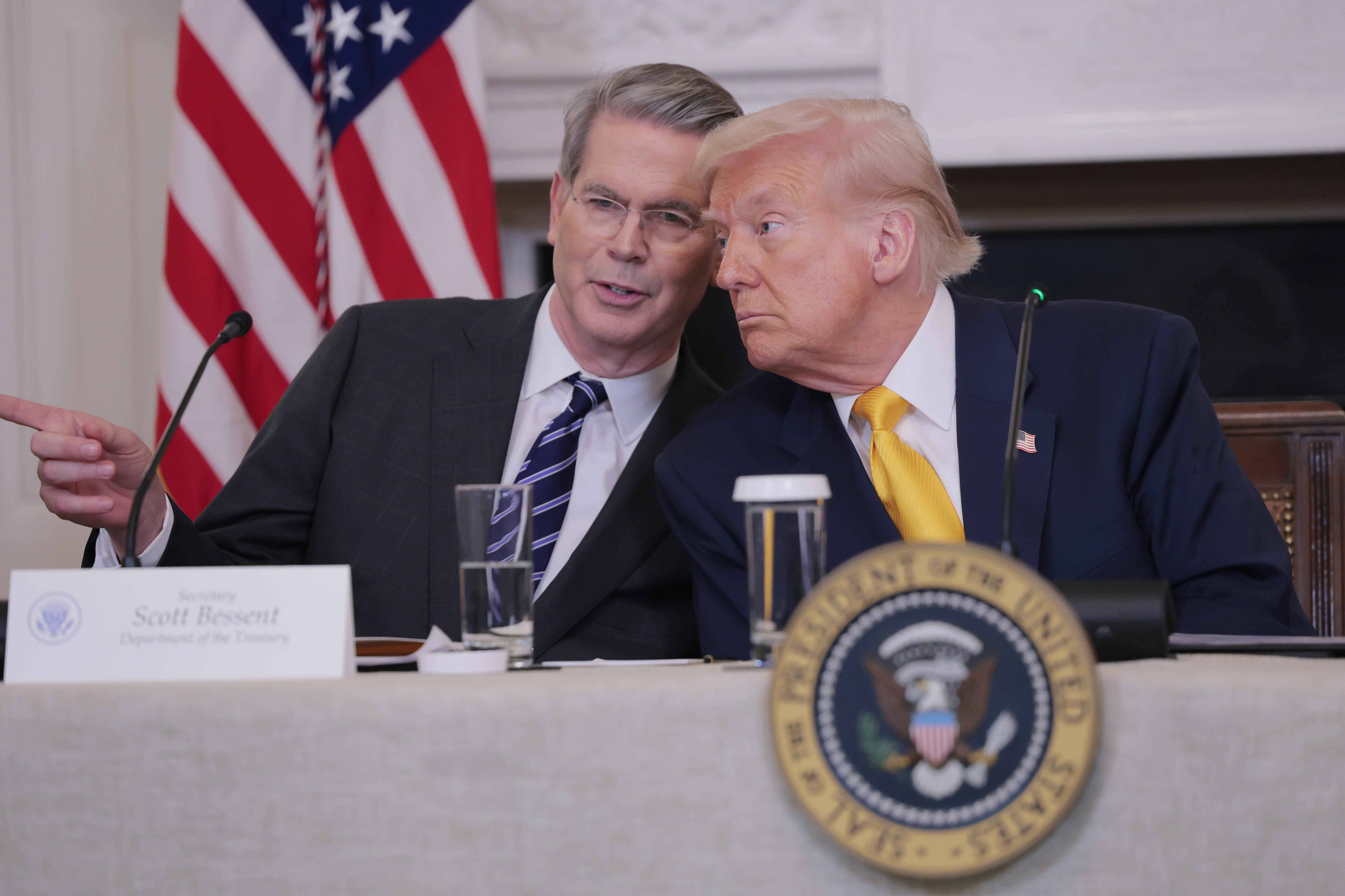 WASHINGTON, DC - MARCH 07: U.S. Secretary of Treasury Scott Bessent and U.S. President Donald Trump look on during The White House Digital Assets Summit in the State Dining Room of the White House on March 07, 2025 in Washington, DC. Trump held the summit to hear from crypto leaders on how his administration has invested in digital assets. (Photo by Anna Moneymaker/Getty Images)