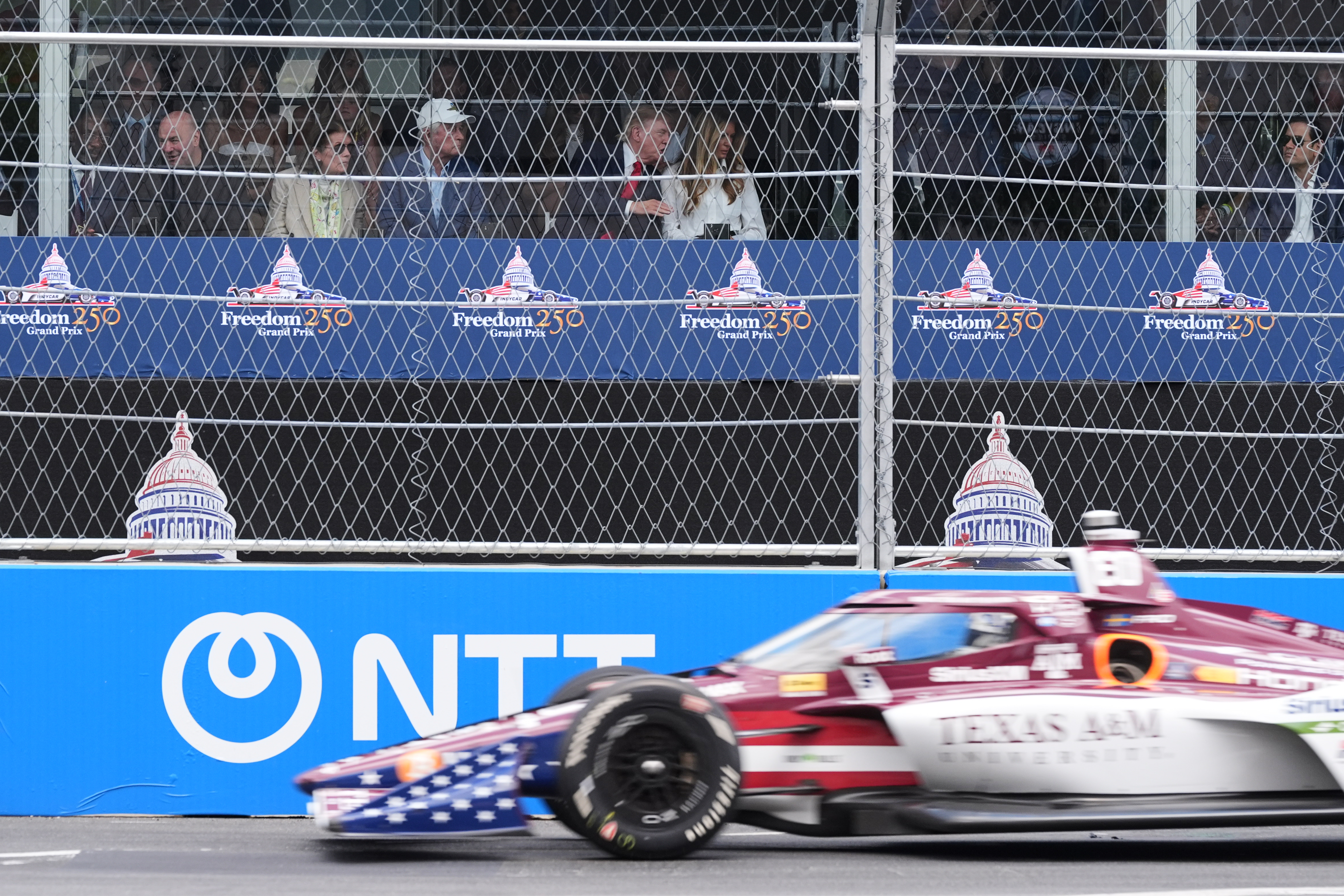 President Donald Trump and first lady Melania Trump watch the IndyCar Freedom 250 Grand Prix auto race in Washington, Sunday, Aug. 23, 2026. (AP Photo/Alex Brandon) (AP Photo/Alex Brandon)