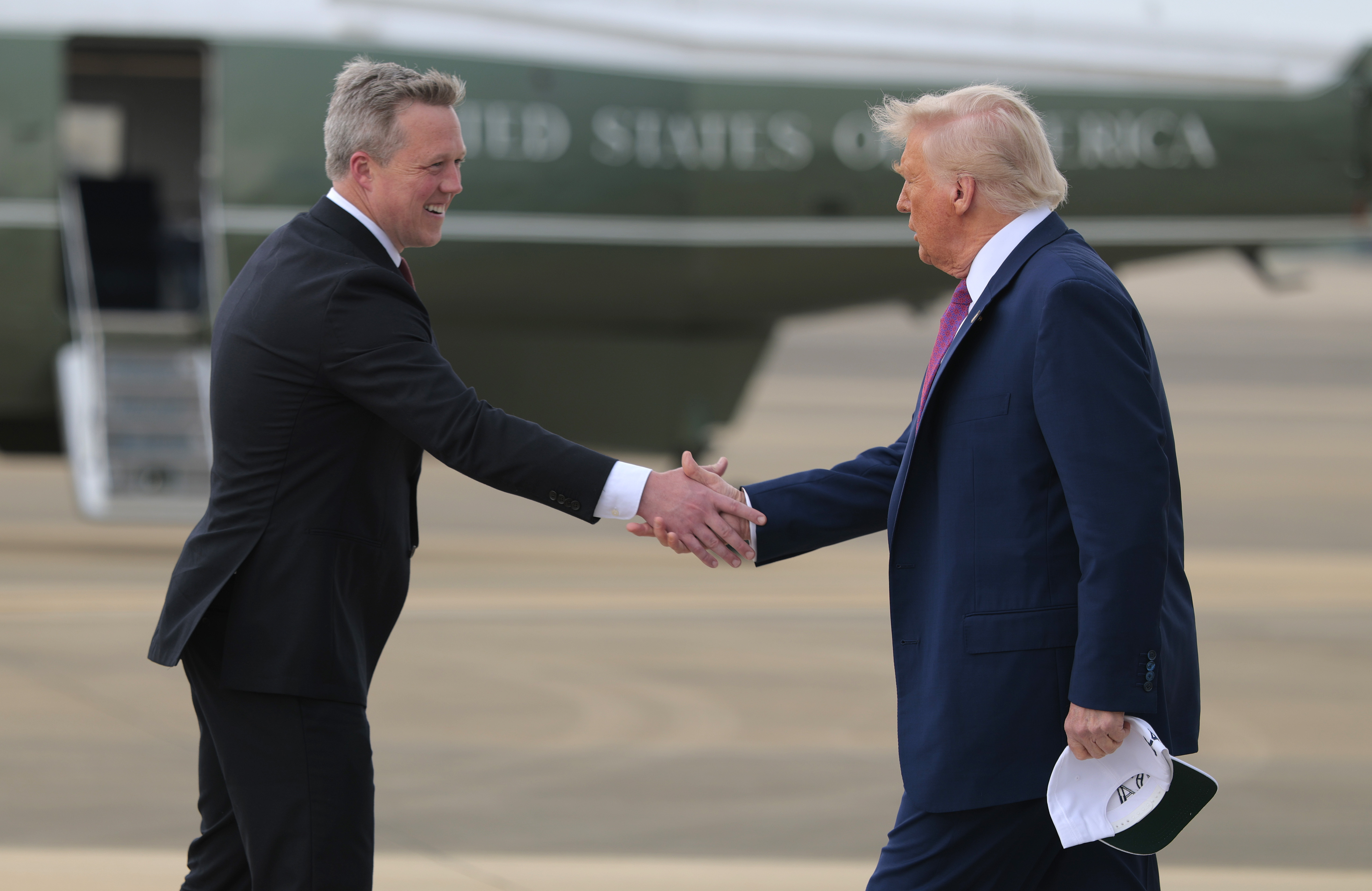 FORT BRAGG, NORTH CAROLINA - JUNE 10: U.S. President Donald Trump is greeted by Secretary of the Army Daniel Driscoll as he arrives at Pope Army Airfield on June 10, 2025 in Fort Bragg, North Carolina. Trump is traveling to Fort Bragg Army base to observe a military demonstration and give remarks in honor of the U.S. Army’s 250th anniversary. (Photo by Anna Moneymaker/Getty Images)