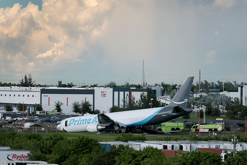 MIAMI, FLORIDA - SEPTEMBER 06: An Amazon cargo plane is seen after it crashed at Miami International Airport on September 06, 2026 in Miami, Florida. In a statement, the Federal Aviation Administration said Prime Air Flight 7598 overran the runway while landing around 2 p.m. after departing from Luis Muñoz Marín International Airport in San Juan, Puerto Rico, earlier today. (Photo by Joe Raedle/Getty Images)