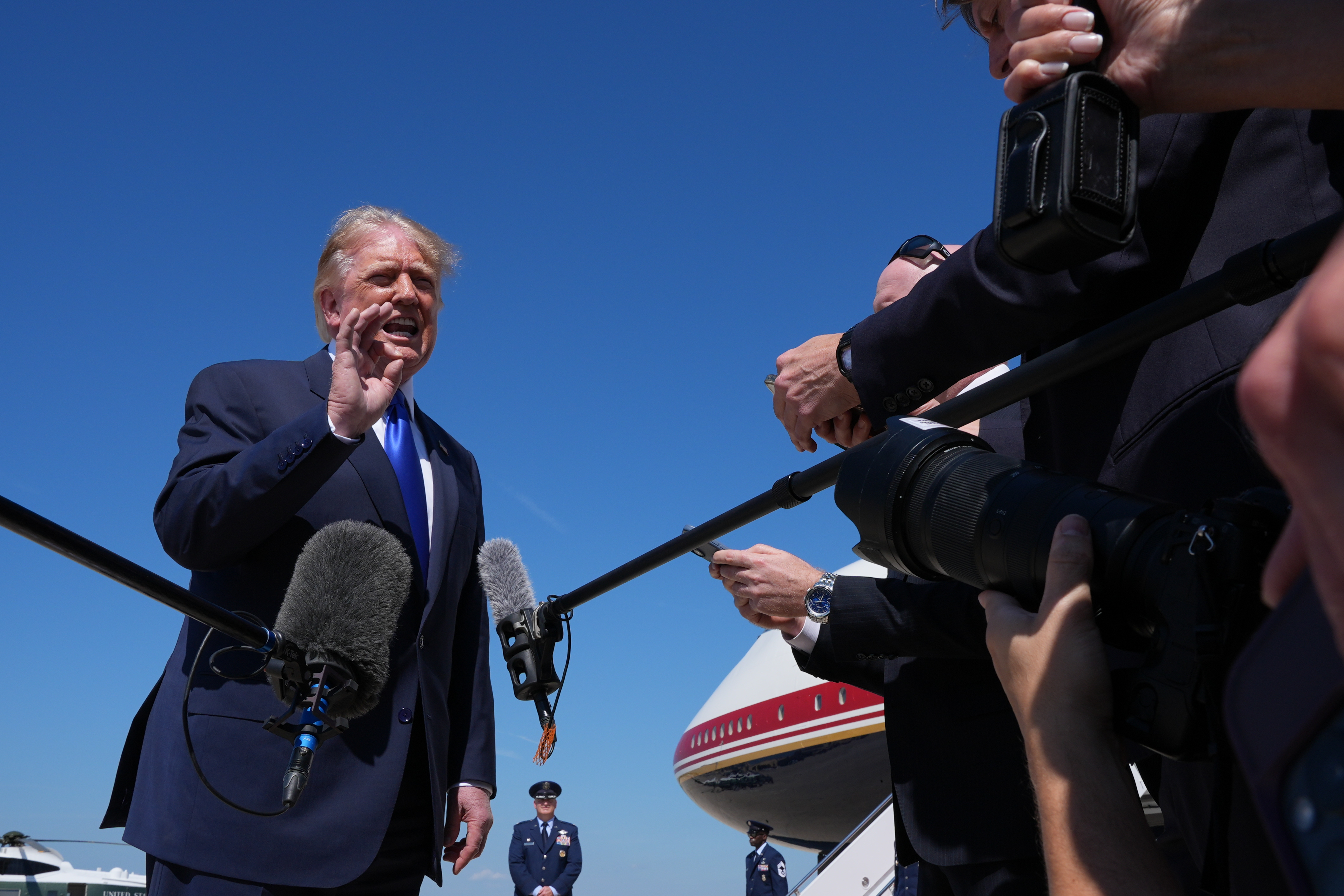 President Donald Trump talks with reporters after an emergency inflatable slide deployed on Air Force One before before Trump arrived to board at Joint Base Andrews, Md., Wednesday, Sept. 9,&nbsp;2026. (AP Photo/Jacquelyn Martin)