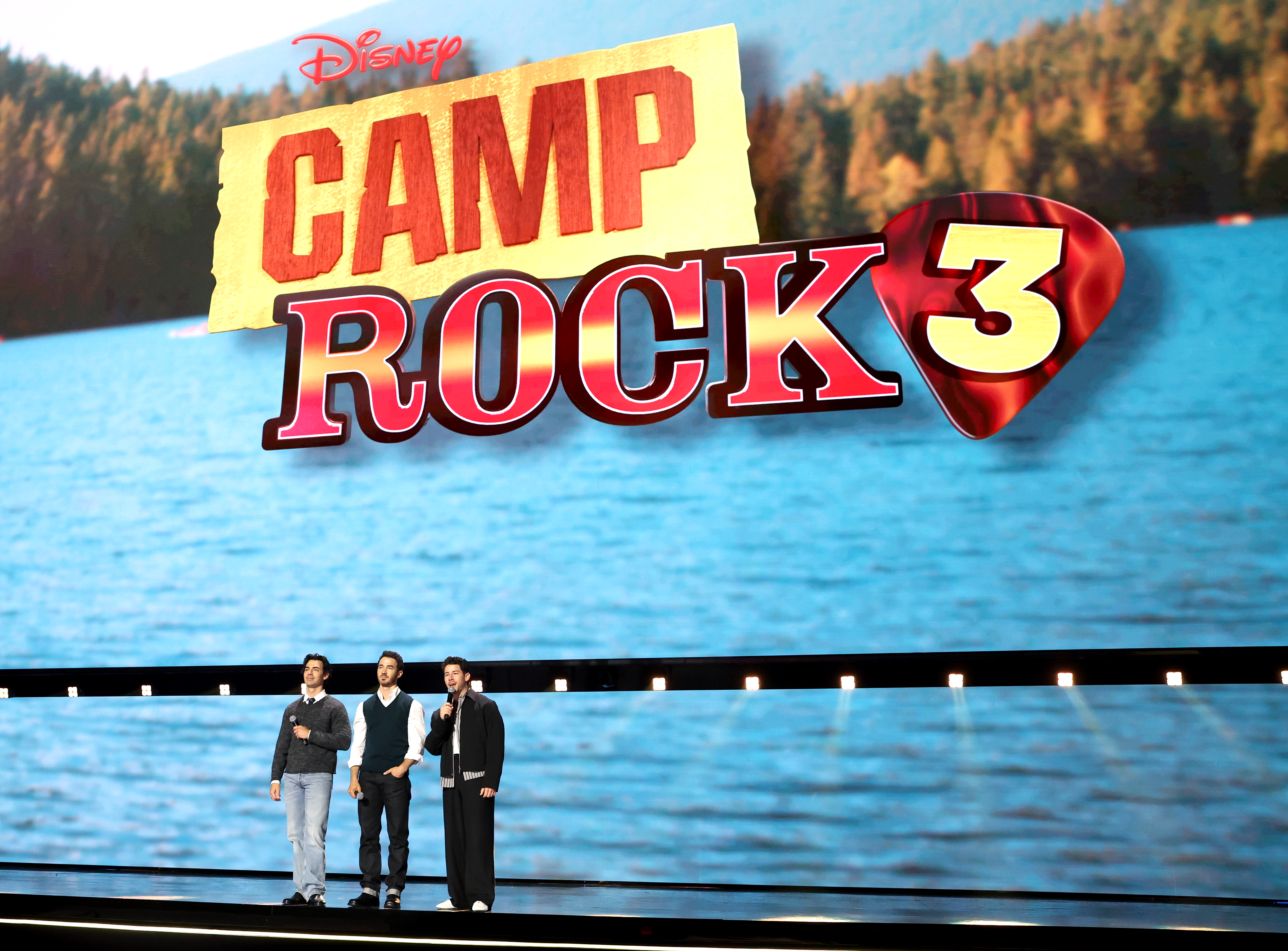 Joe Jonas, Kevin Jonas, and Nick Jonas speak onstage at the Disney Entertainment Showcase at D23: The Ultimate Disney Fan Event on August 14, 2026 in Anaheim, California (Jesse Grant/Getty Images for Disney)
