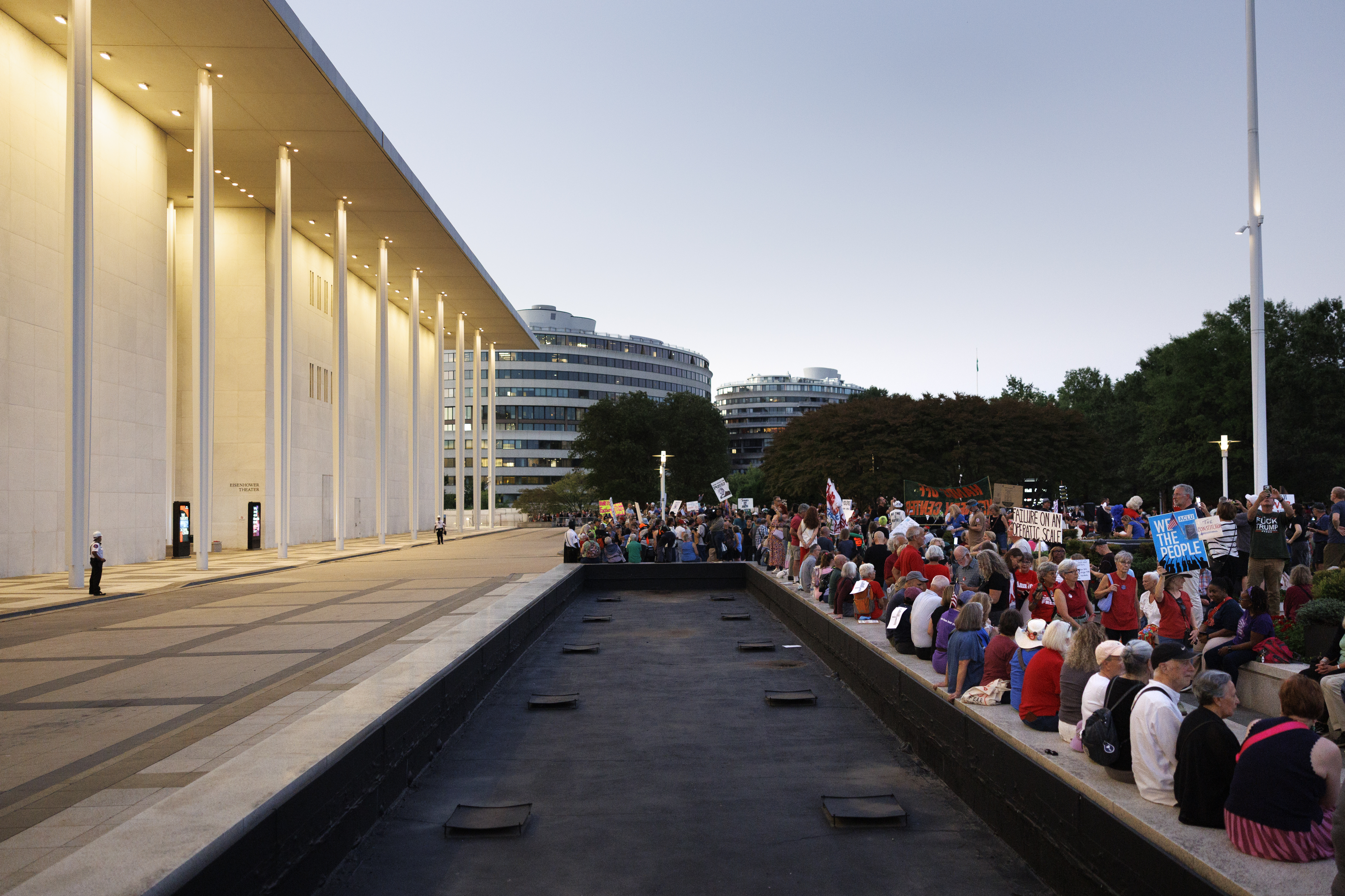 WASHINGTON, DC - SEPTEMBER 18: Demonstrators hold hands to form a human chain during a rally outside the John F. Kennedy Center for the Performing Arts on September 18, 2026 in Washington, DC. Demonstrators gathered to form a human chain around the building after President Trump announced the potential closure of the facility.(Photo by Tom Brenner/Getty Images)