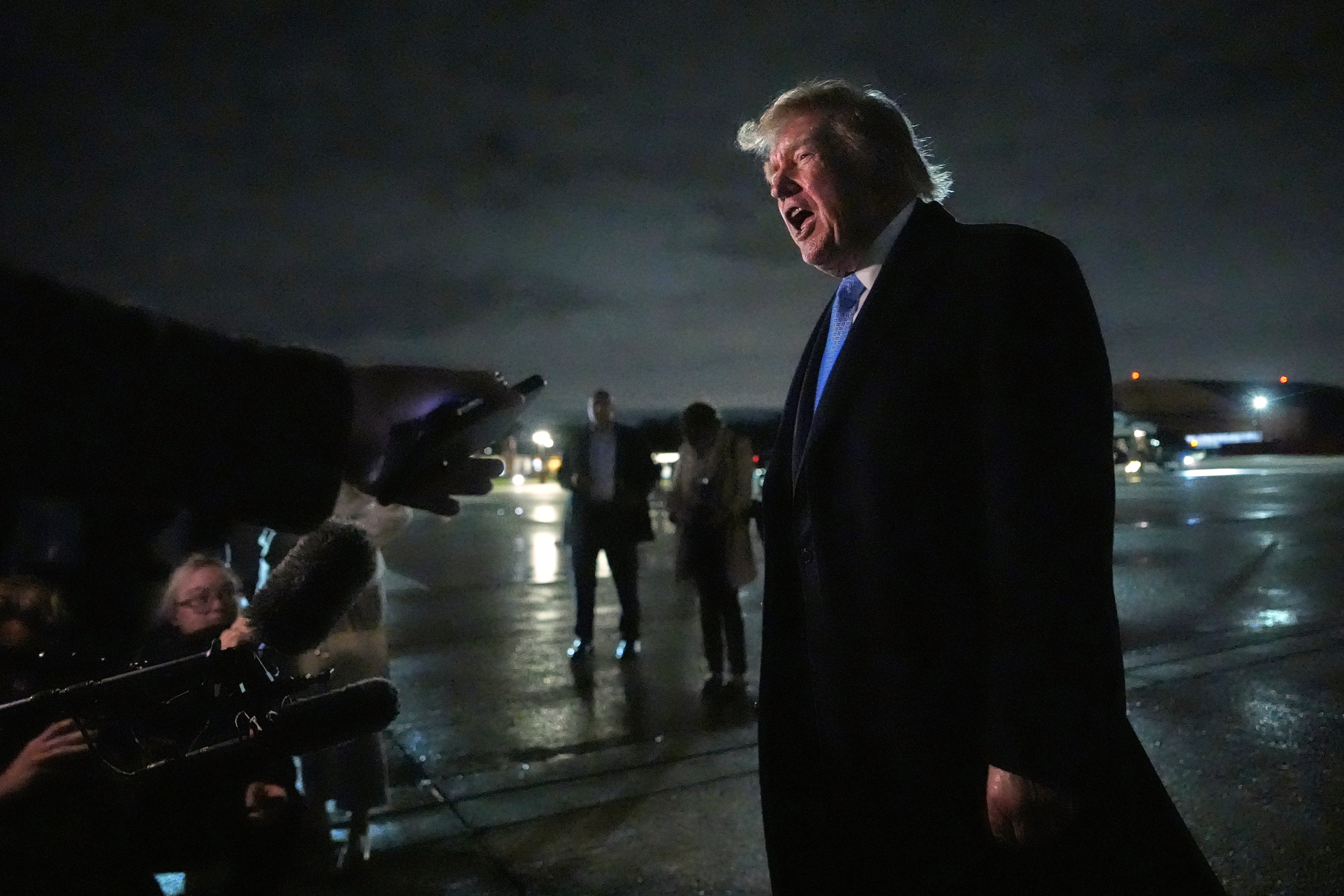 President Donald Trump speaks with reporters upon arriving, Sunday, Sept. 27, 2026, at Joint Base Andrews, Md. (AP Photo/Julia Demaree Nikhinson)