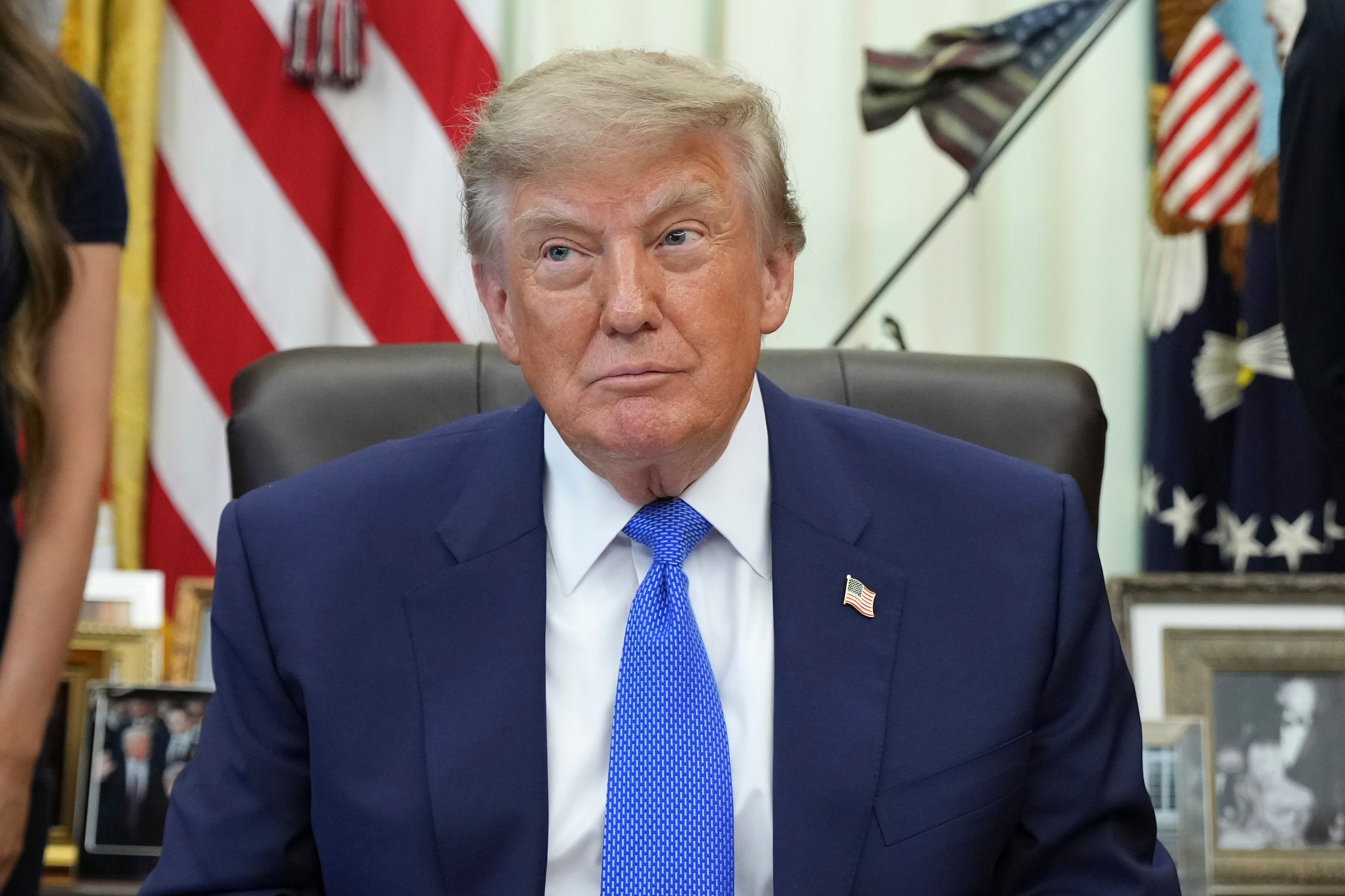 President Donald Trump sits before signing an executive order about vaccines in the Oval Office of the White House, Monday, Aug. 10, 2026, in Washington. (AP Photo/Jacquelyn Martin)