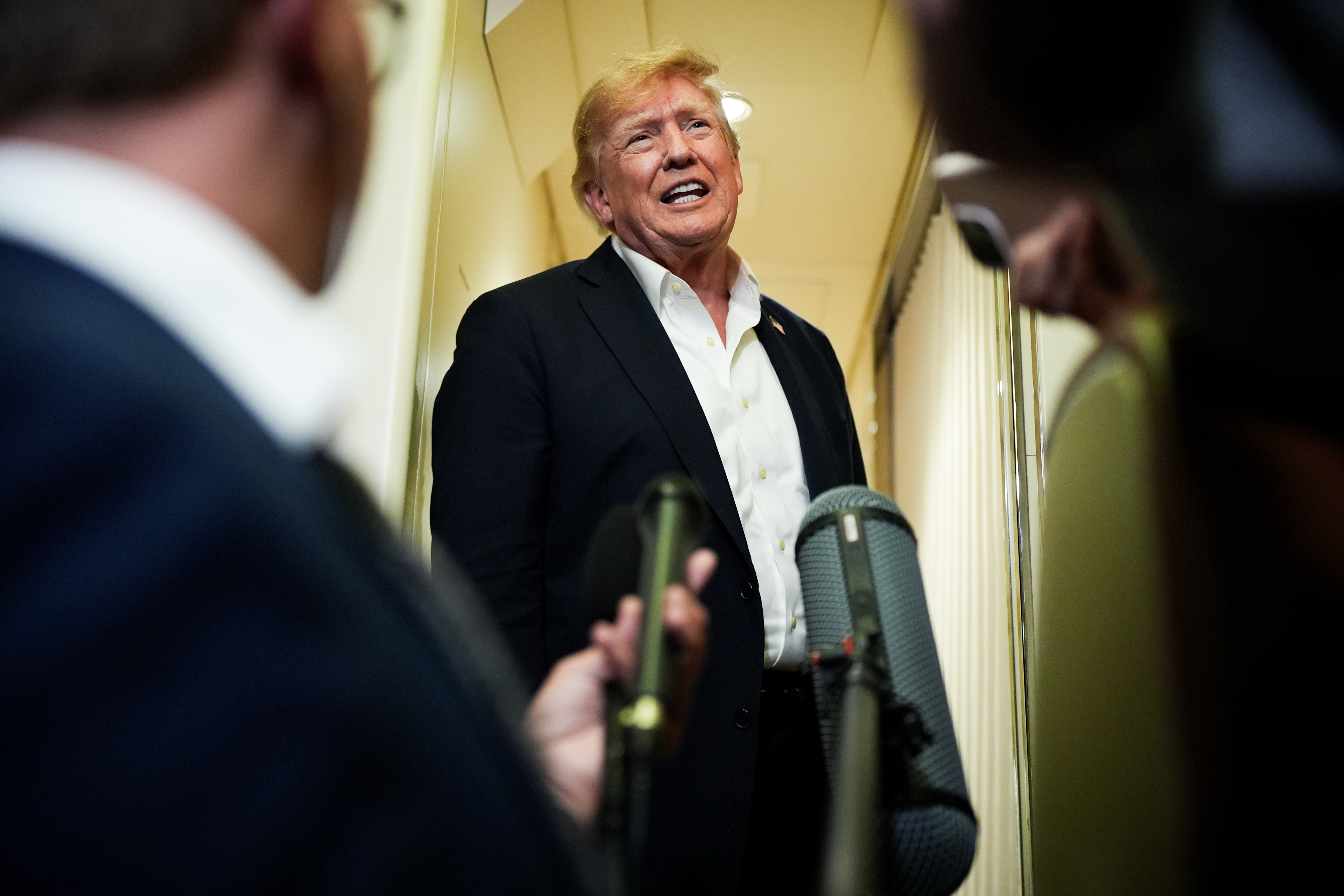 President Donald Trump speaks with reporters while in flight on Air Force One from Shannon, Ireland to Joint Base Andrews, Md., Sunday, Sept. 13, 2026. (AP Photo/Julia Demaree Nikhinson)