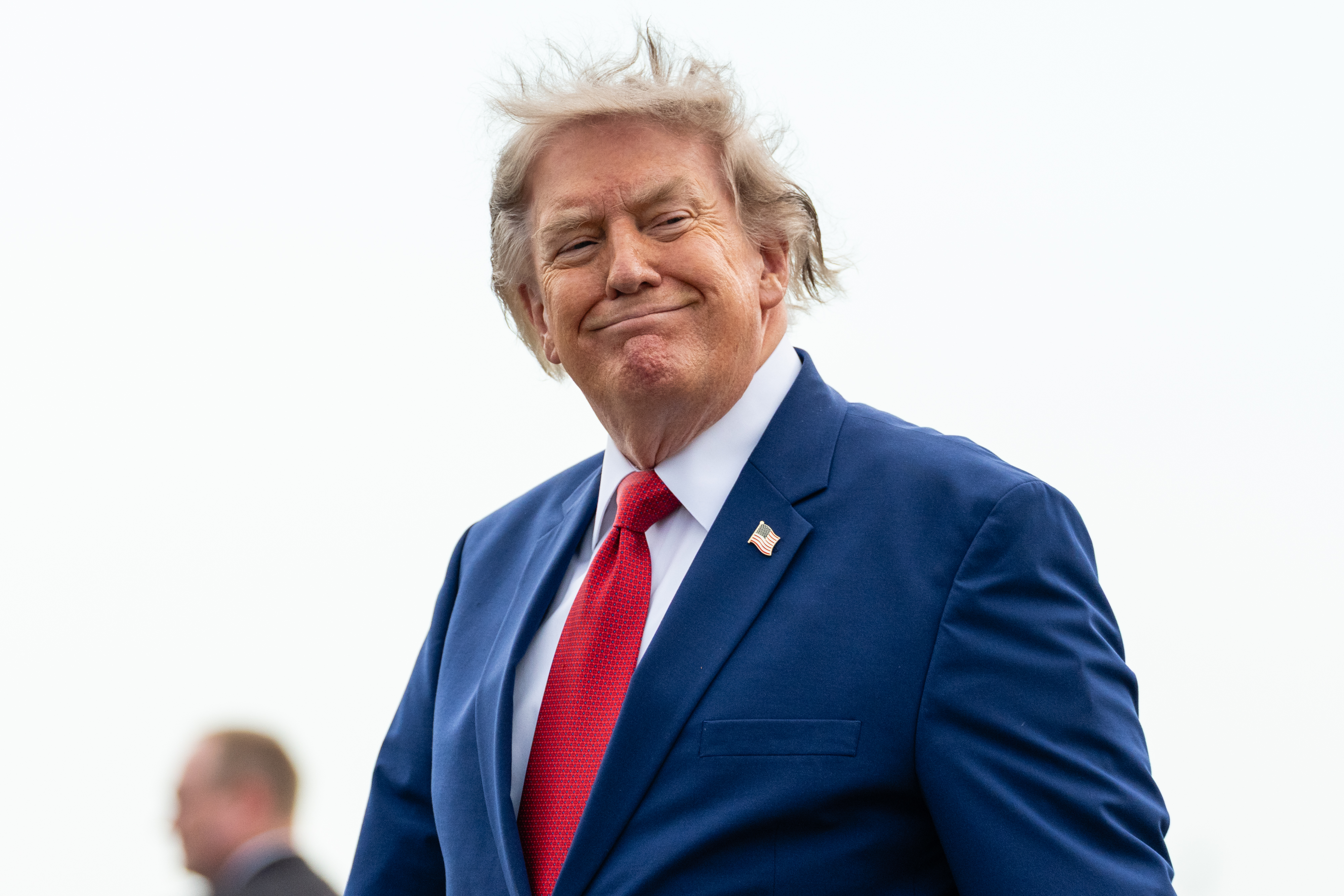 NEWARK, NEW JERSEY - AUGUST 07: U.S. President Donald Trump walks off of Air Force One at Newark Liberty International Airport on August 7, 2026 in Newark, New Jersey. President Trump is spending the weekend at Trump National Golf Club Bedminster. (Photo by Eric Lee/Getty Images)
