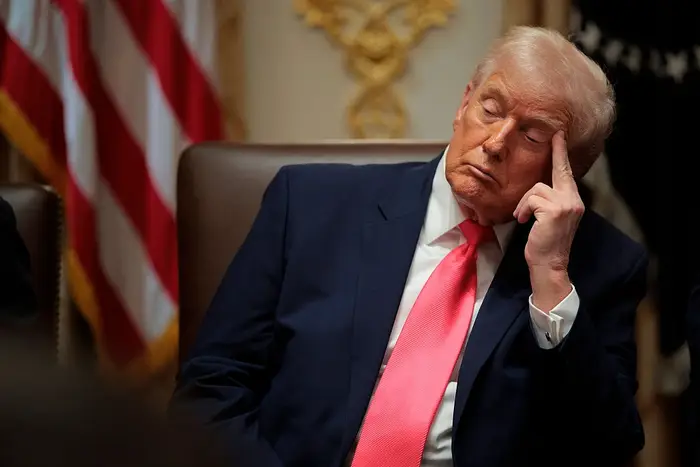 U.S. President Donald Trump attends a meeting of his Cabinet in the Cabinet Room of the White House on December 02, 2025 in Washington, DC. A bipartisan Congressional investigation has begun...