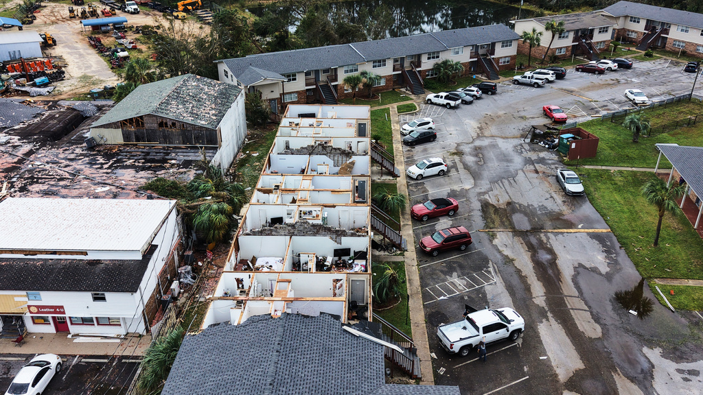 An apartment complex which had its roof ripped off is seen in the aftermath of Hurricane Isaias in Milton, Fla., Saturday, Oct. 10, 2026. (AP Photo/Gerald Herbert)