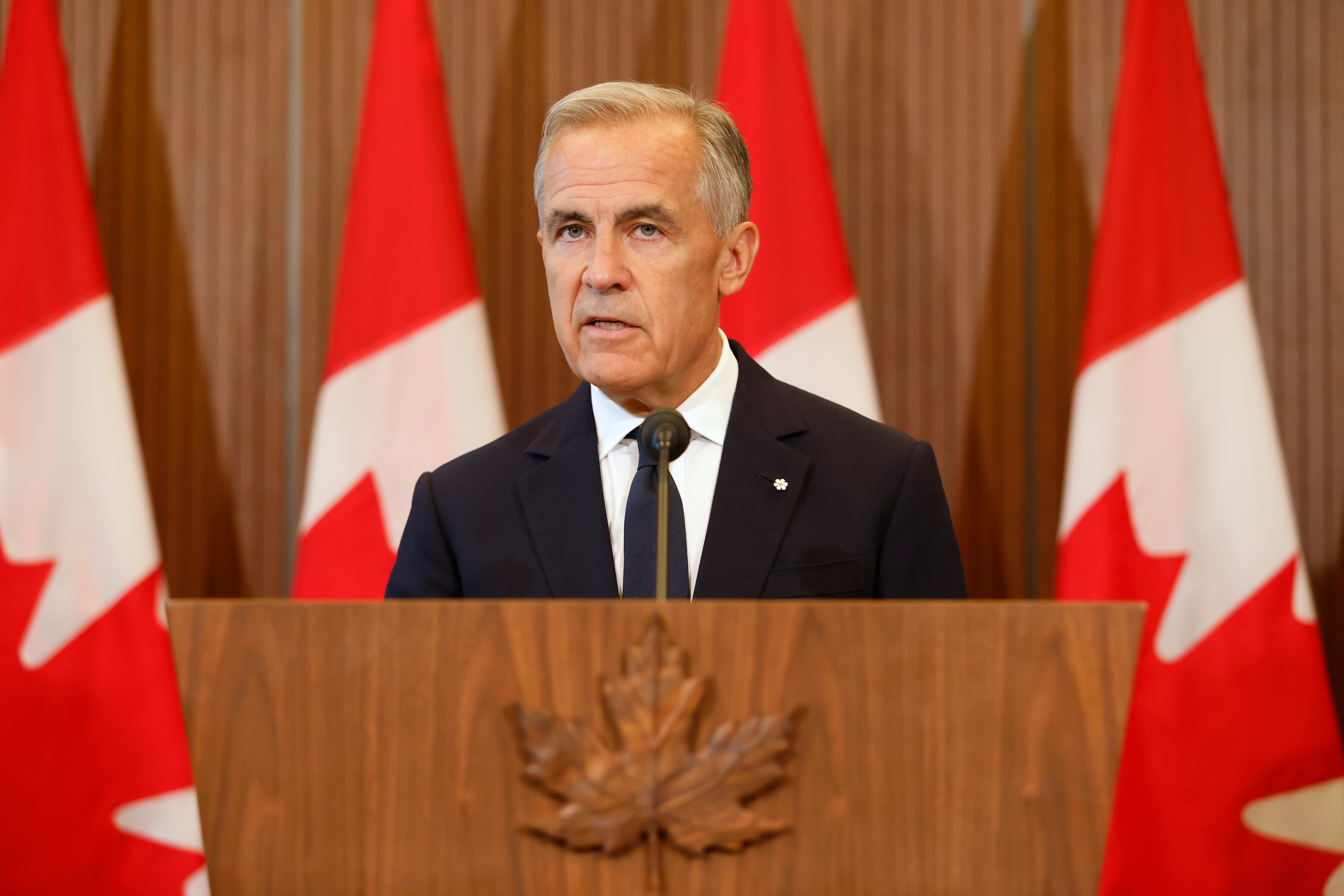 Prime Minister Mark Carney speaks about Canada's response to new U.S. tariffs during a news conference on Parliament Hill in Ottawa on Saturday, Aug. 22, 2026. (Patrick Doyle/The Canadian Press via AP)