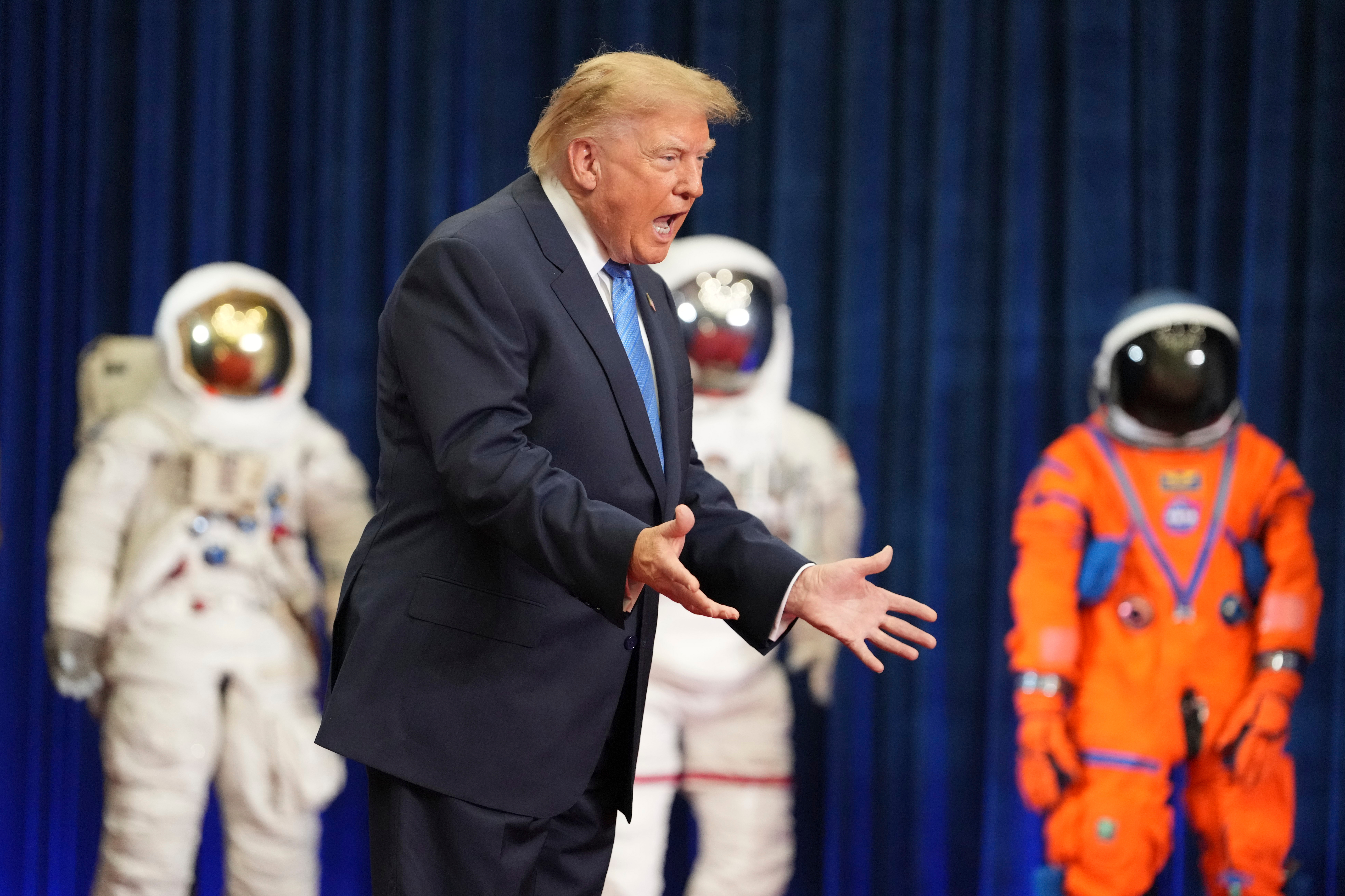 President Donald Trump arrives to present the Congressional Space Medal of Honor to Artemis II crew members, Friday, Aug. 28, 2026, at Johnson Space Center in Houston. (AP Photo/Mark Schiefelbein)