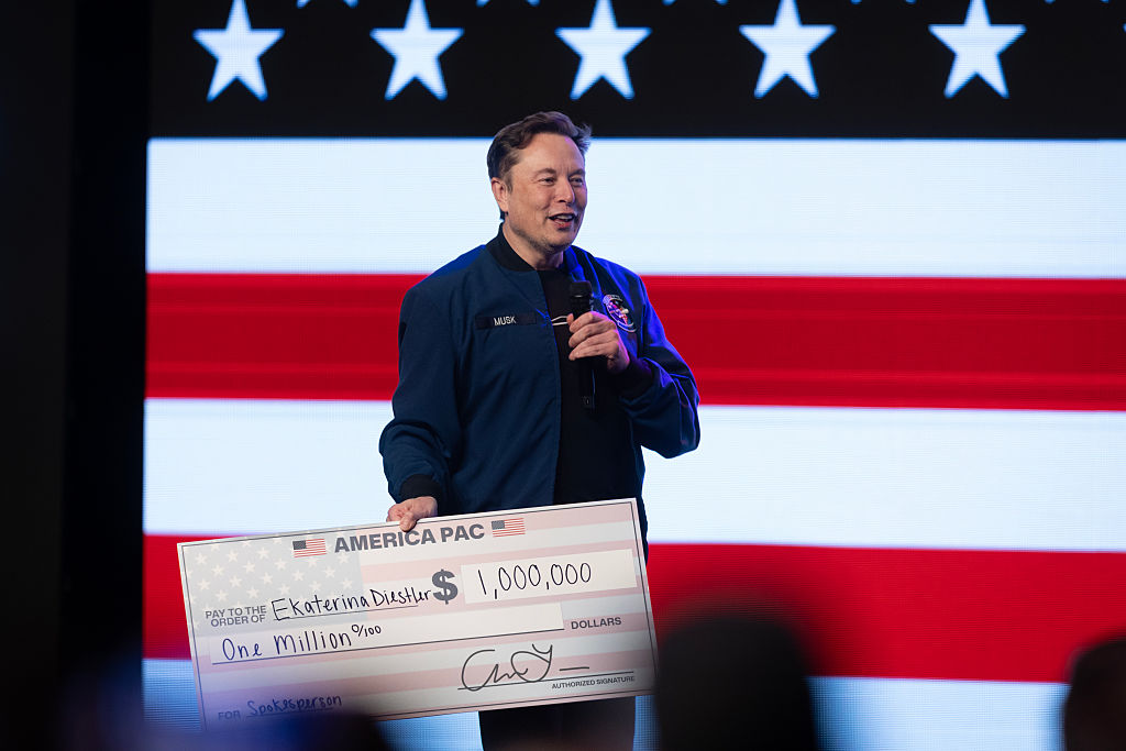 GREEN BAY, WISCONSIN - MARCH 30: Billionaire businessman Elon Musk prepares to give $1,000,000 to a Wisconsin voter during a town hall meeting he was hosting at the KI Convention Center on March 30, 2025 in Green Bay, Wisconsin. The town hall is being held in front of the state’s high-profile Supreme Court election between Circuit Court Judge Brad Schimel, who has been financially backed by Musk and endorsed by President Donald Trump, and Dane County Circuit Court Judge Susan Crawford. (Photo by Scott Olson/Getty Images)