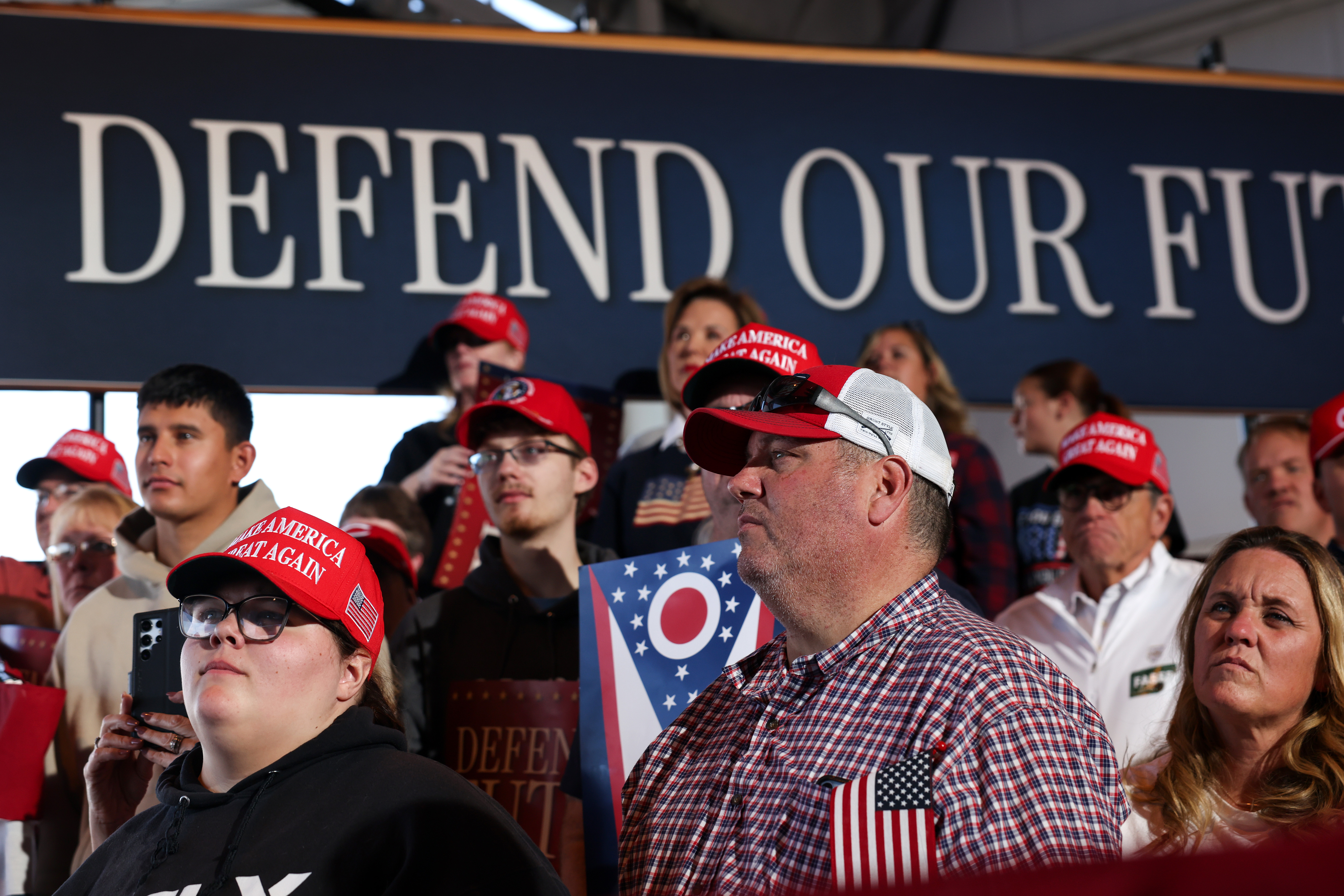 Attendees listen as Vice President JD Vance speaks at a rally at the Allen County Regional Airport, Friday, Oct. 9, 2026, in Lima, Ohio. (Samuel Corum/Pool Photo via AP)