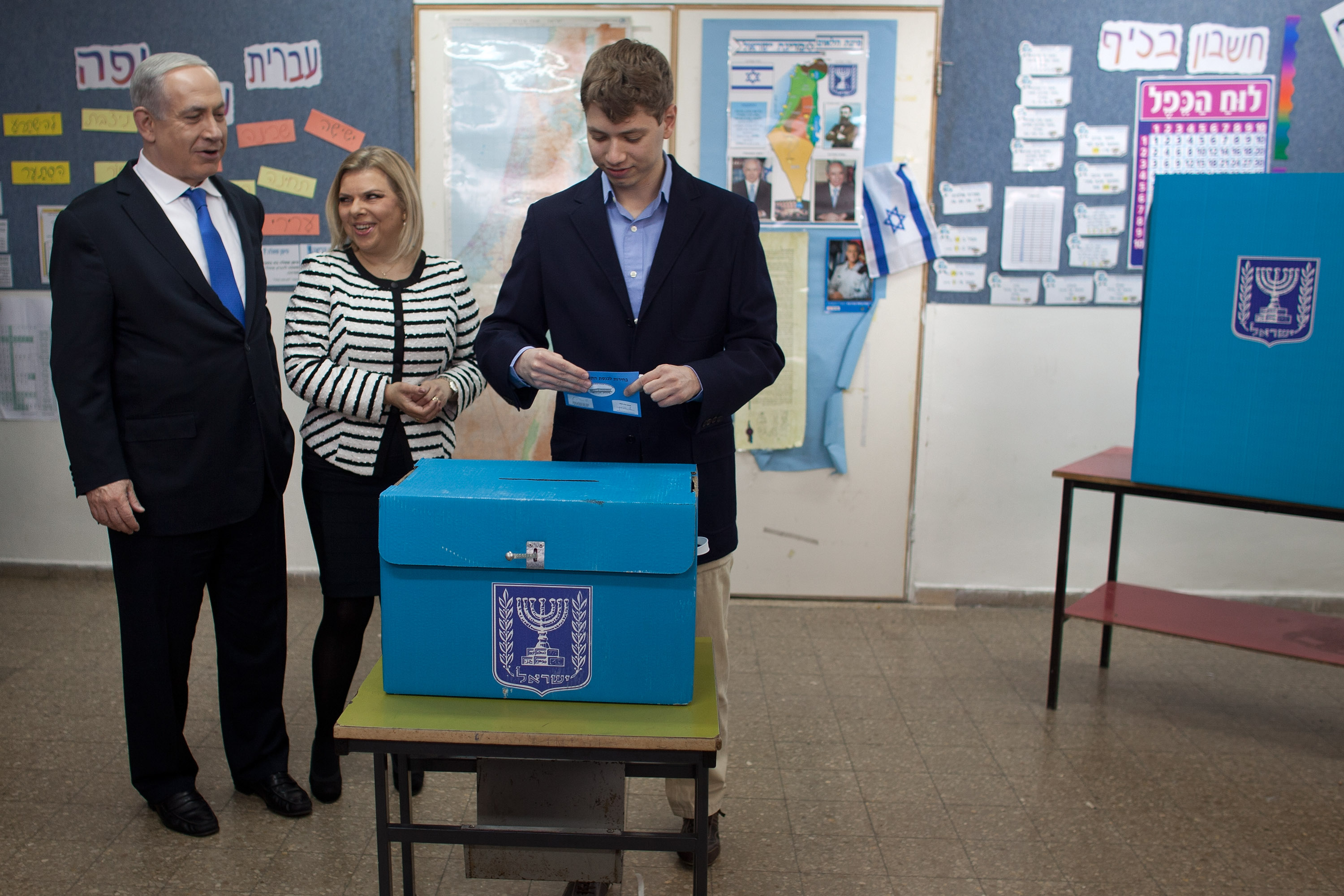 JERUSALEM, ISRAEL - JANUARY 22: (ISRAEL OUT) Israeli Prime Minister Benjamin Netanyahu watches his son Yair Netanyahu cast his ballot with by wife Sara Netanyahu at a polling station on election day on January 22, 2013 in Jerusalem, Israel. Israel's general election voting has begun today as polls show Netanyahu is expected to return to office with a narrow majority. (Photo by Uriel Sinai/Getty Images)