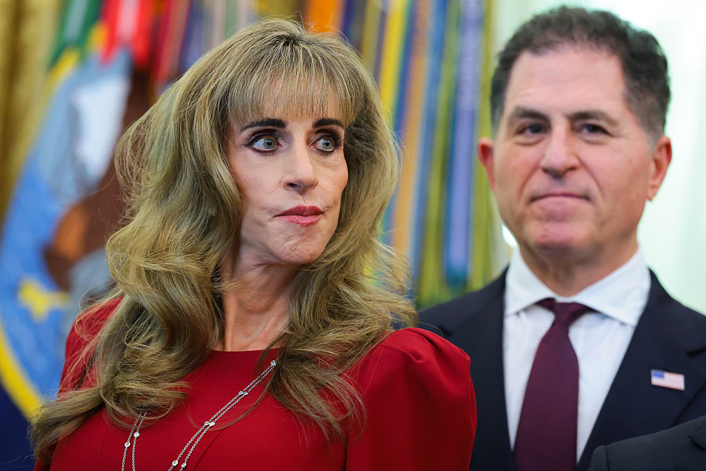 WASHINGTON, DC - OCTOBER 07: Dell Technologies CEO Michael Dell and his wife Susan Dell look on during an event in the Oval Office of the White House on October 07, 2026 in Washington, DC. President Trump announced that automatic enrollment in the $1,000 government seed deposit for children born between 2025 and 2028 known as