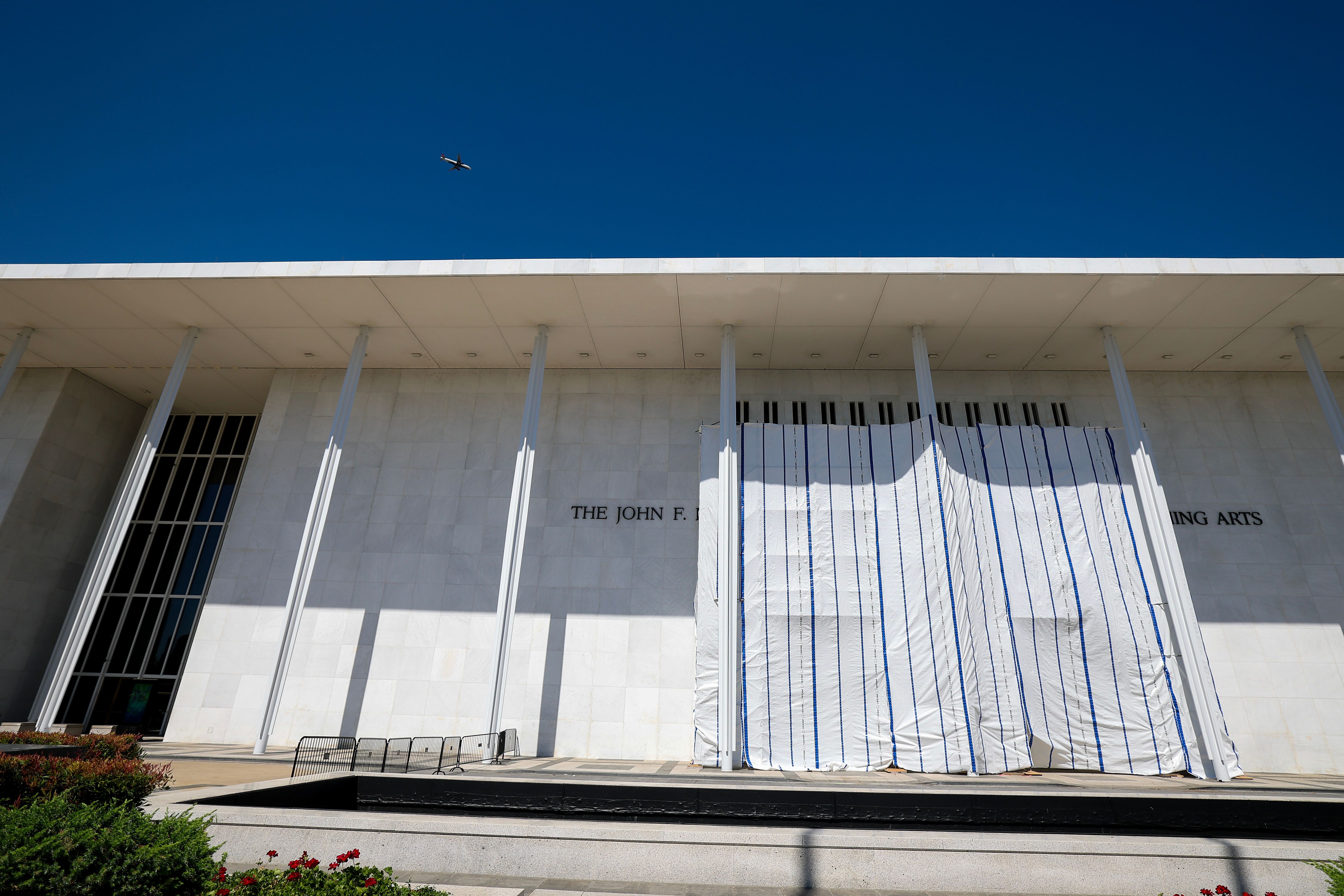 WASHINGTON, DC - JUNE 13: Tarps are hung on scaffolding outside The Kennedy Center on June 13, 2026 in Washington, DC. Friday late night workers removed the President Donald Trump's name from the Kennedy Center. (Photo by Tasos Katopodis/Getty Images)(Photo by Tasos Katopodis/Getty Images)