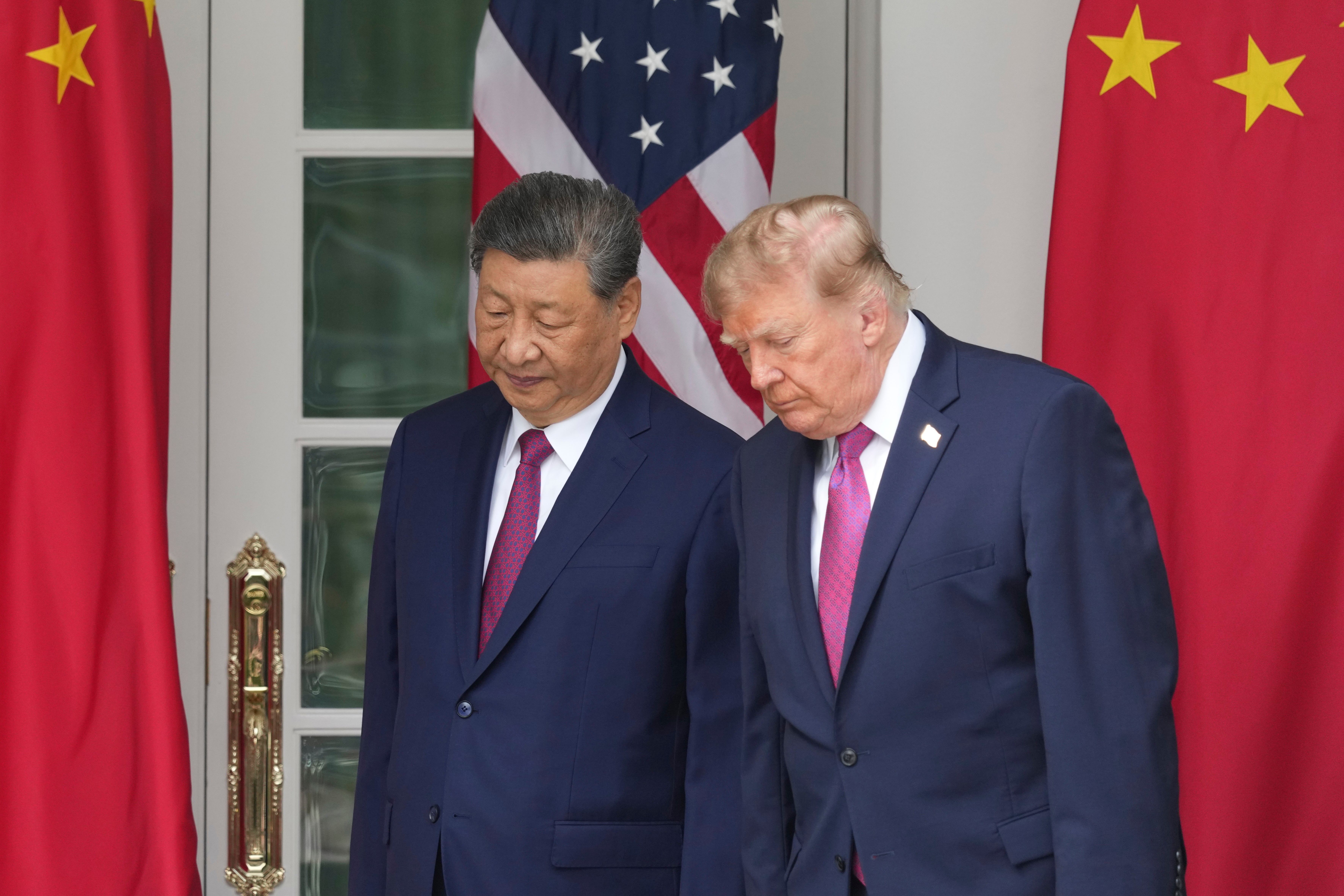 President Donald Trump, right, and China's President Xi Jinping arrive to watch a military review in the Rose Garden of the White House, Thursday, Sept. 24, 2026, in Washington. (AP Photo/Alex Brandon)
