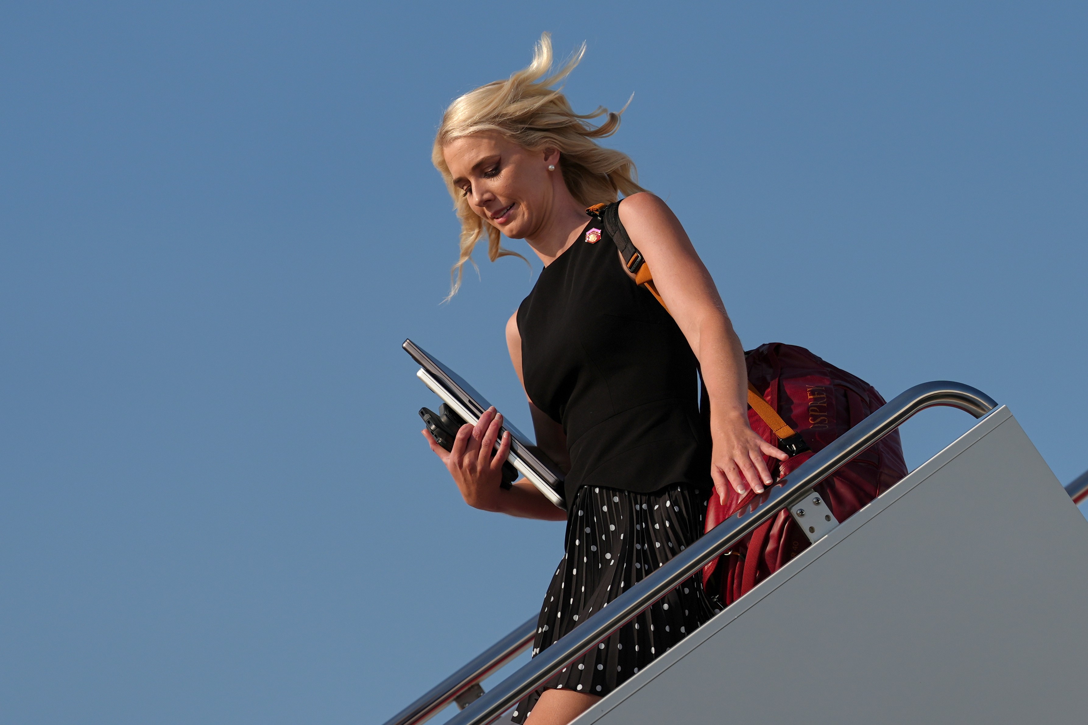 White House aide Natalie Harp disembarks Air Force One, Sunday, Aug. 9, 2026, at Joint Base Andrews, Md. (AP Photo/Julia Demaree Nikhinson)