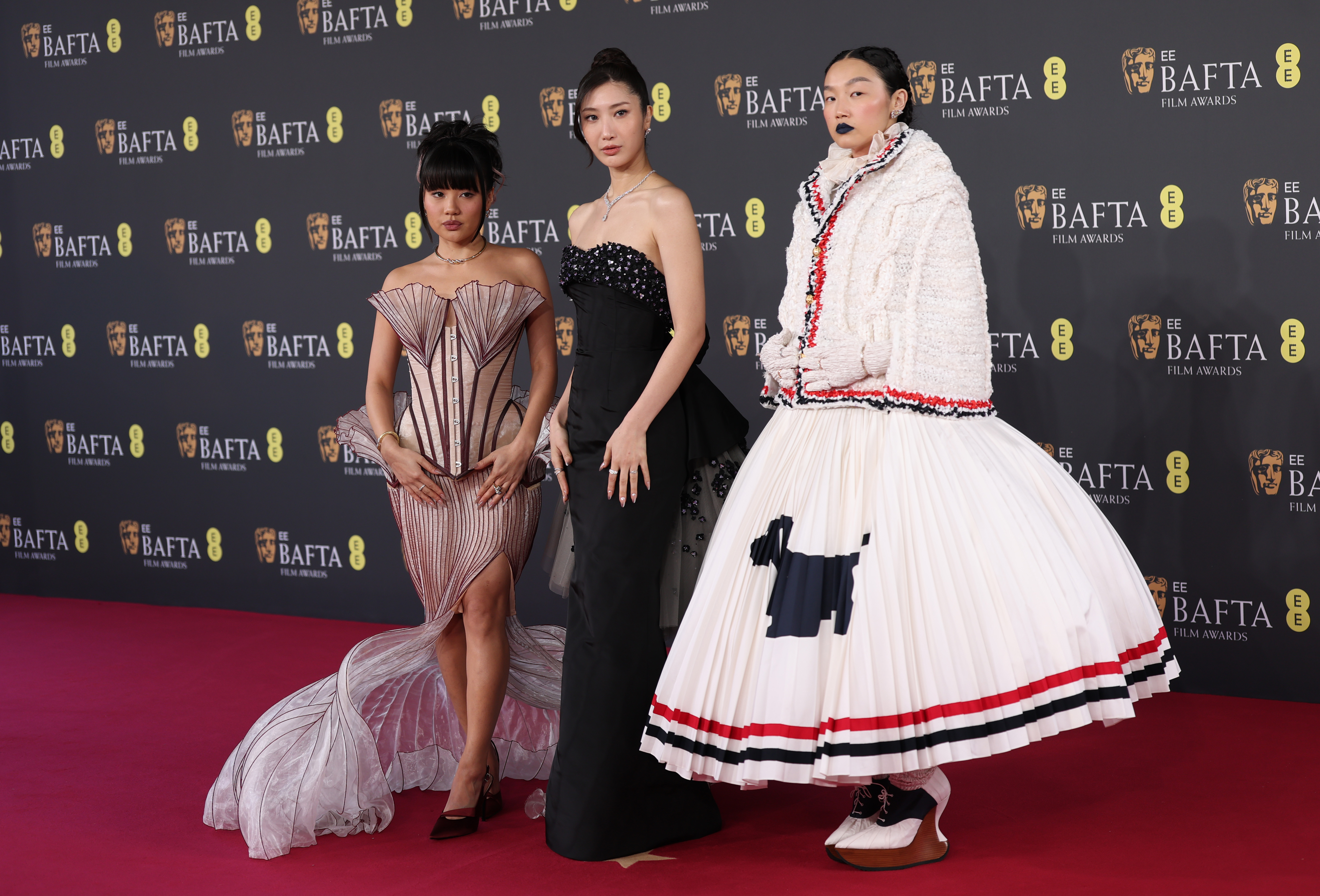 LONDON, ENGLAND - FEBRUARY 22: (L-R) Rei Ami, EJAE and Audrey Nuna attend the 2026 EE BAFTA Film Awards at The Royal Festival Hall on February 22, 2026 in London, England. (Photo by Mike Marsland/WireImage)