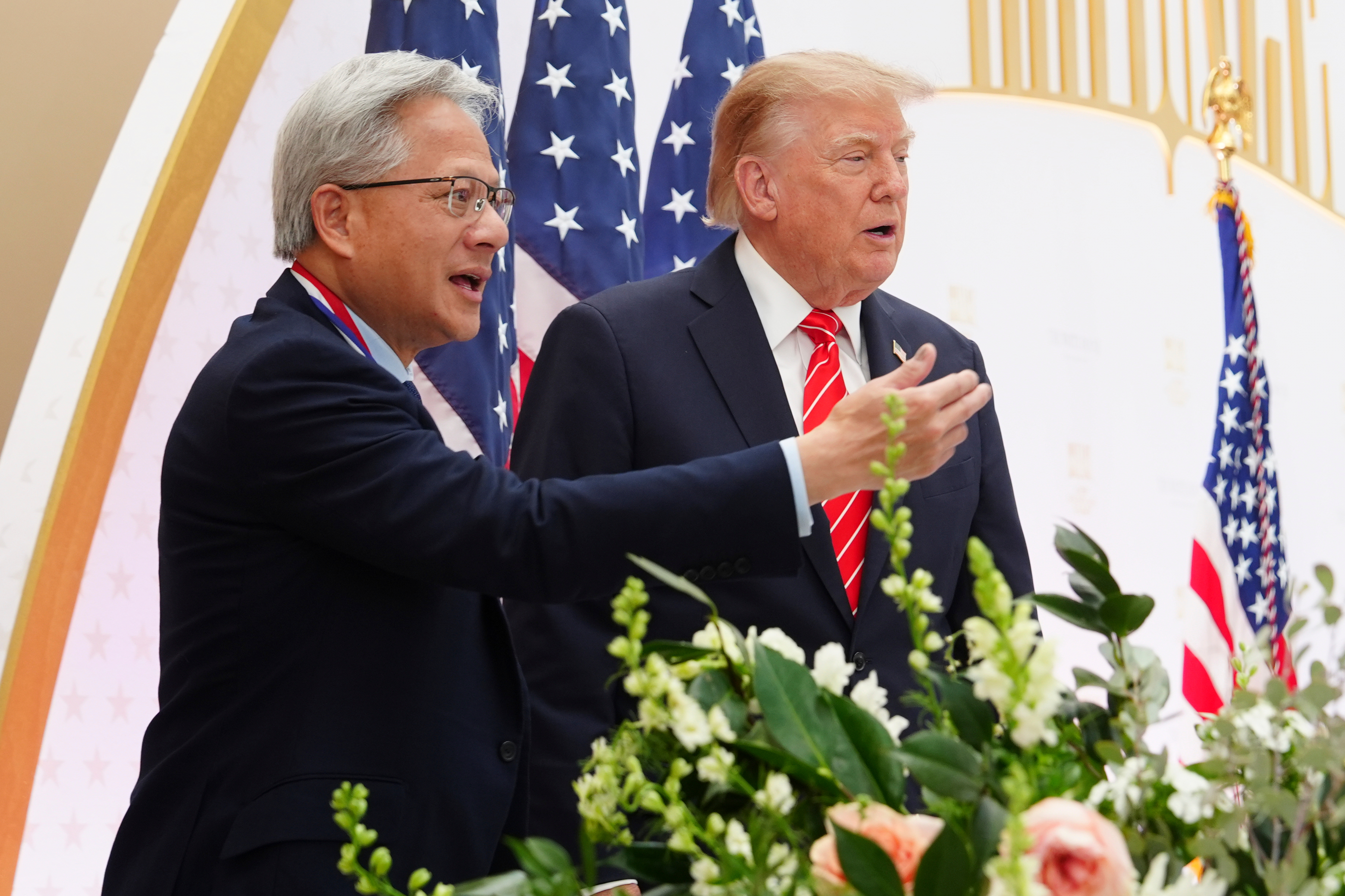 President Donald Trump, right, and National Medal of Science recipient Nvidia CEO Jensen Huang are pictured during an event at the U.S. Institute of Peace, Thursday, Oct. 8, 2026, in Washington. (AP Photo/Julia Demaree Nikhinson)