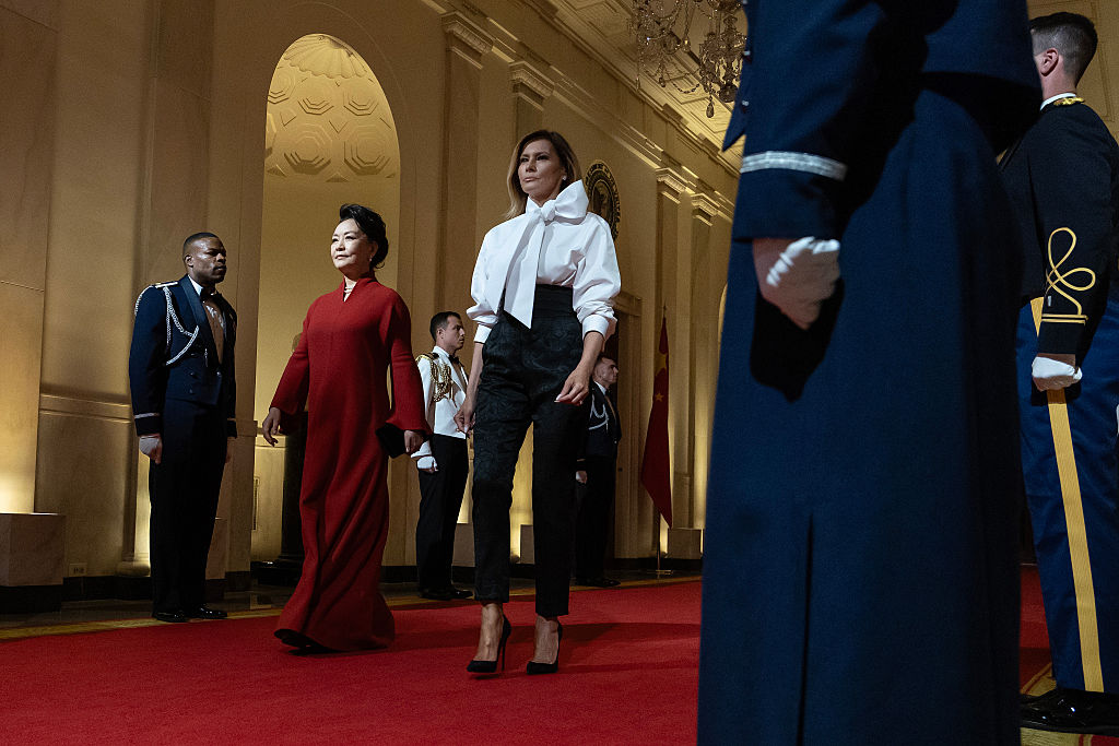 WASHINGTON, DC - SEPTEMBER 24: Chinese first lady Peng Liyuan (L) walks with first lady Melania Trump as they arrive for a state dinner in the East Room of the White House on September 24, 2026 in Washington, DC. Trump is hosting Xi for a three-day state visit to Washington, DC, where the leaders were expected to discuss trade practices, artificial intelligence and the furthering of