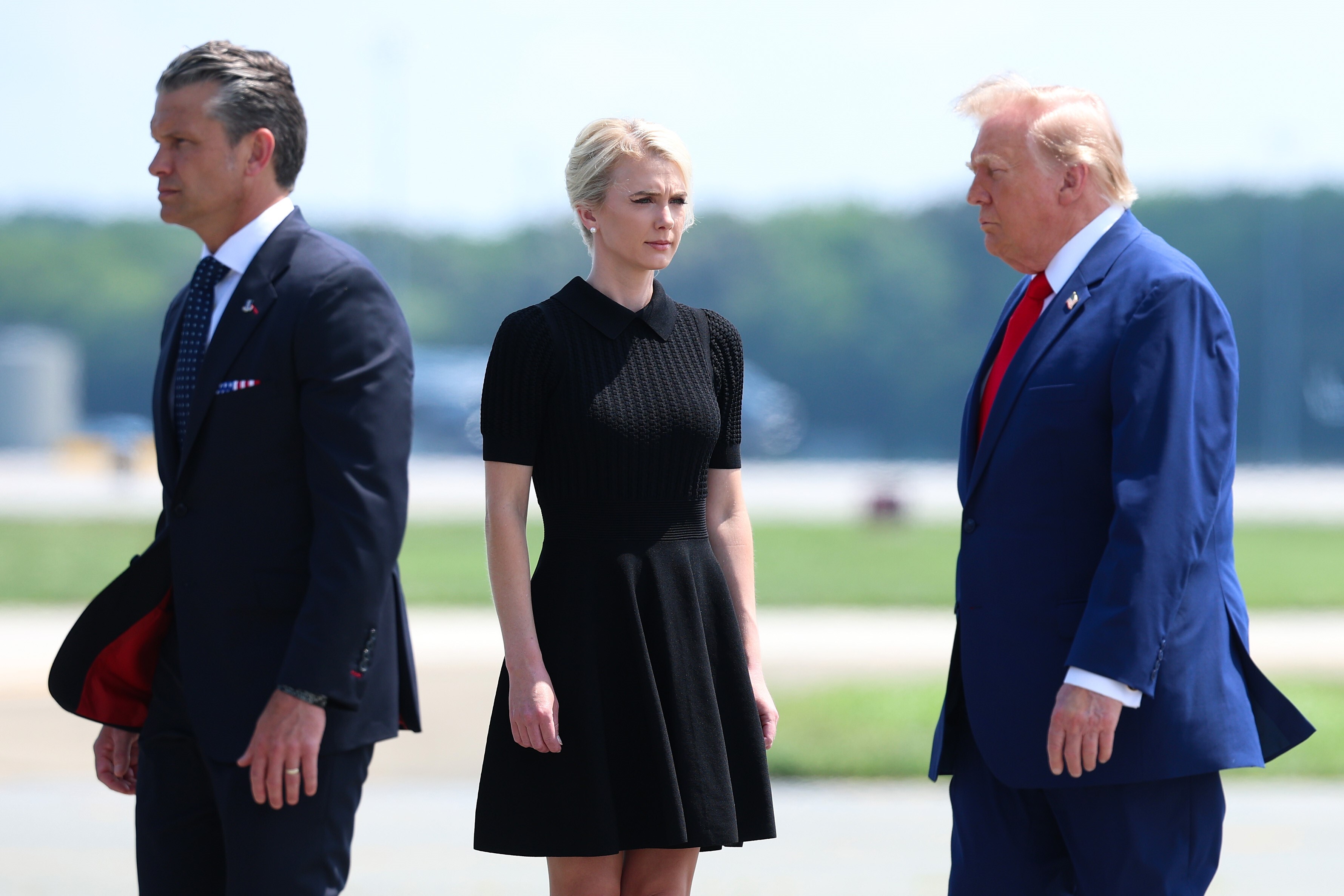 U.S. Secretary of War Pete Hegseth, executive assistant to U.S. President Donald Trump Natalie Harp and U.S. President Donald Trump attend a dignified transfer at Dover Air Force Base on July 22,...