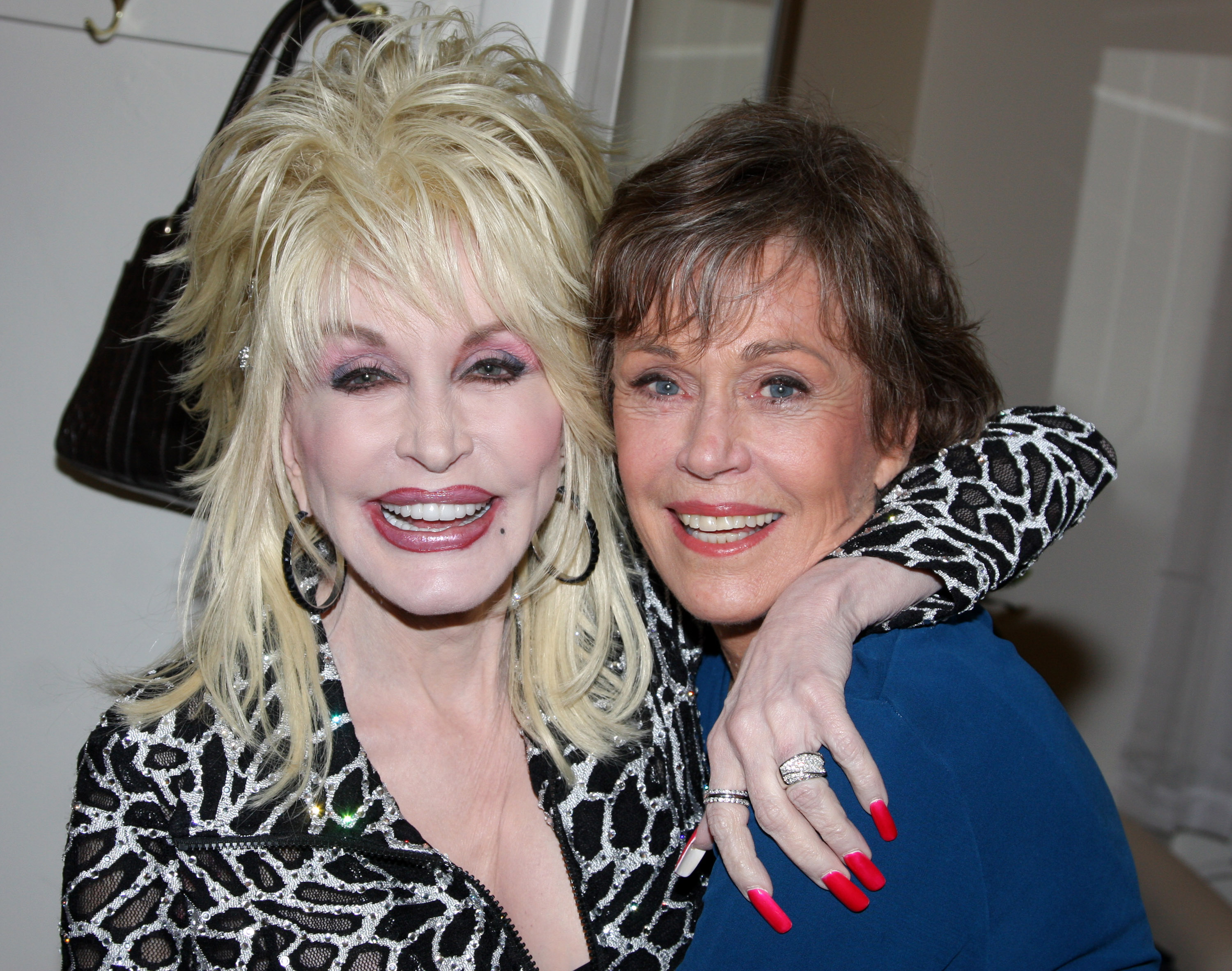 NEW YORK - MARCH 09: Dolly Parton visits Jane Fonda backstage on opening night of
