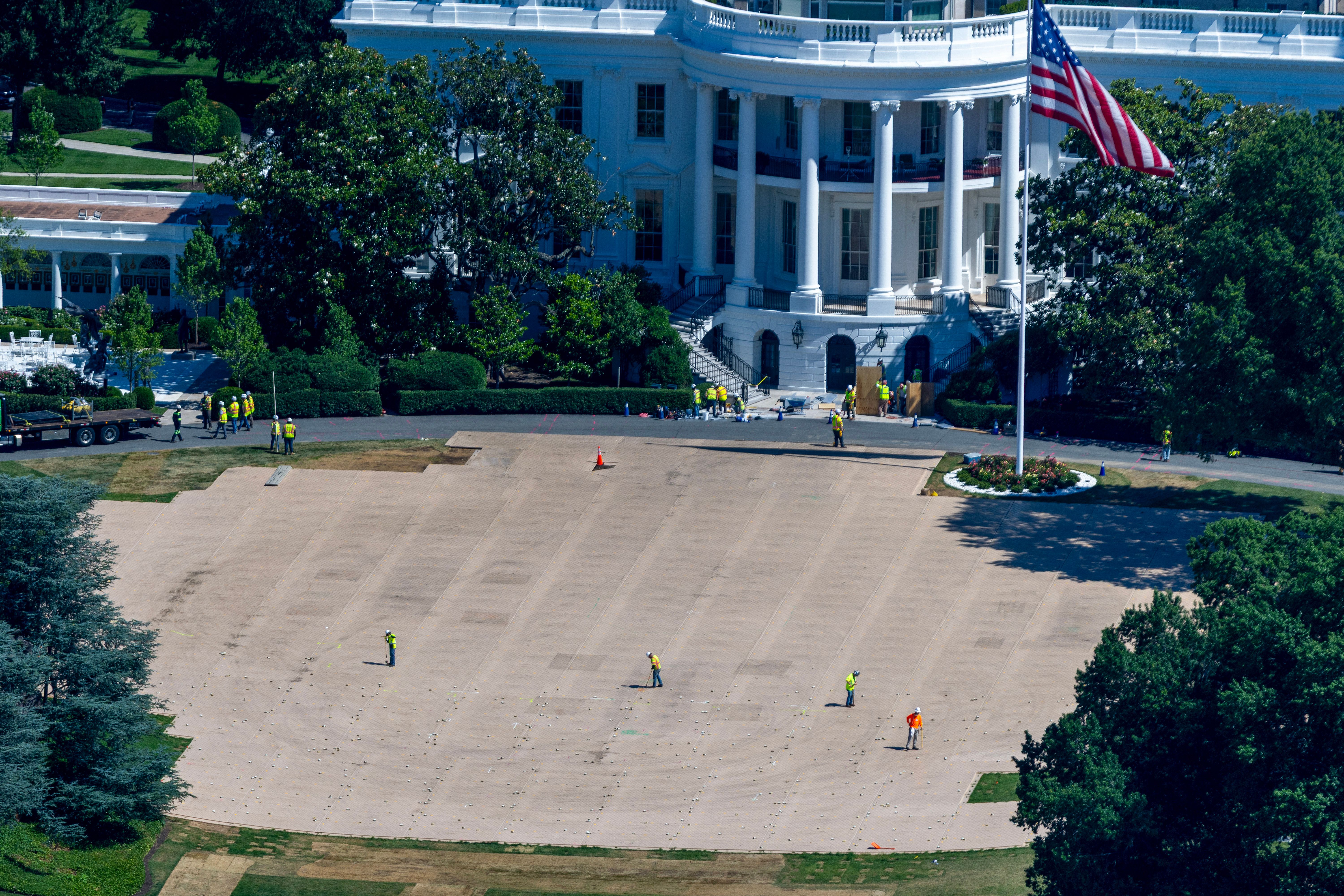 WASHINGTON, DC - JUNE 24: Construction of the new White House ballroom continues as crews continue to repair the grass after the Ultimate Fighting Championship Freedom 250