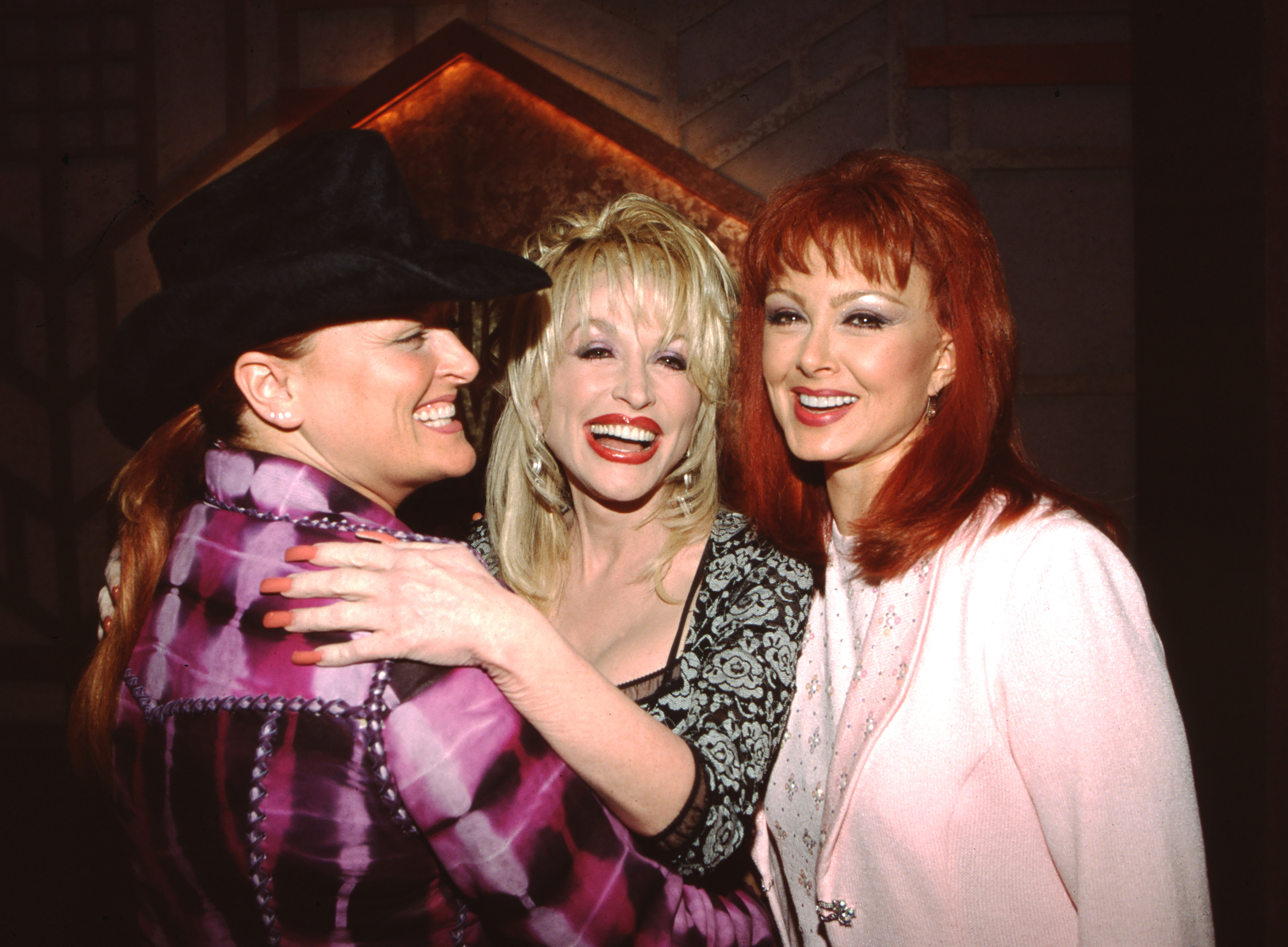 Naomi and Wynonna Judd The Judds with Dolly Parton Backstage at the ACM Awards at Universal Ampitheater, Circa 1990s (Photo by Ron Wolfson/Getty Images)