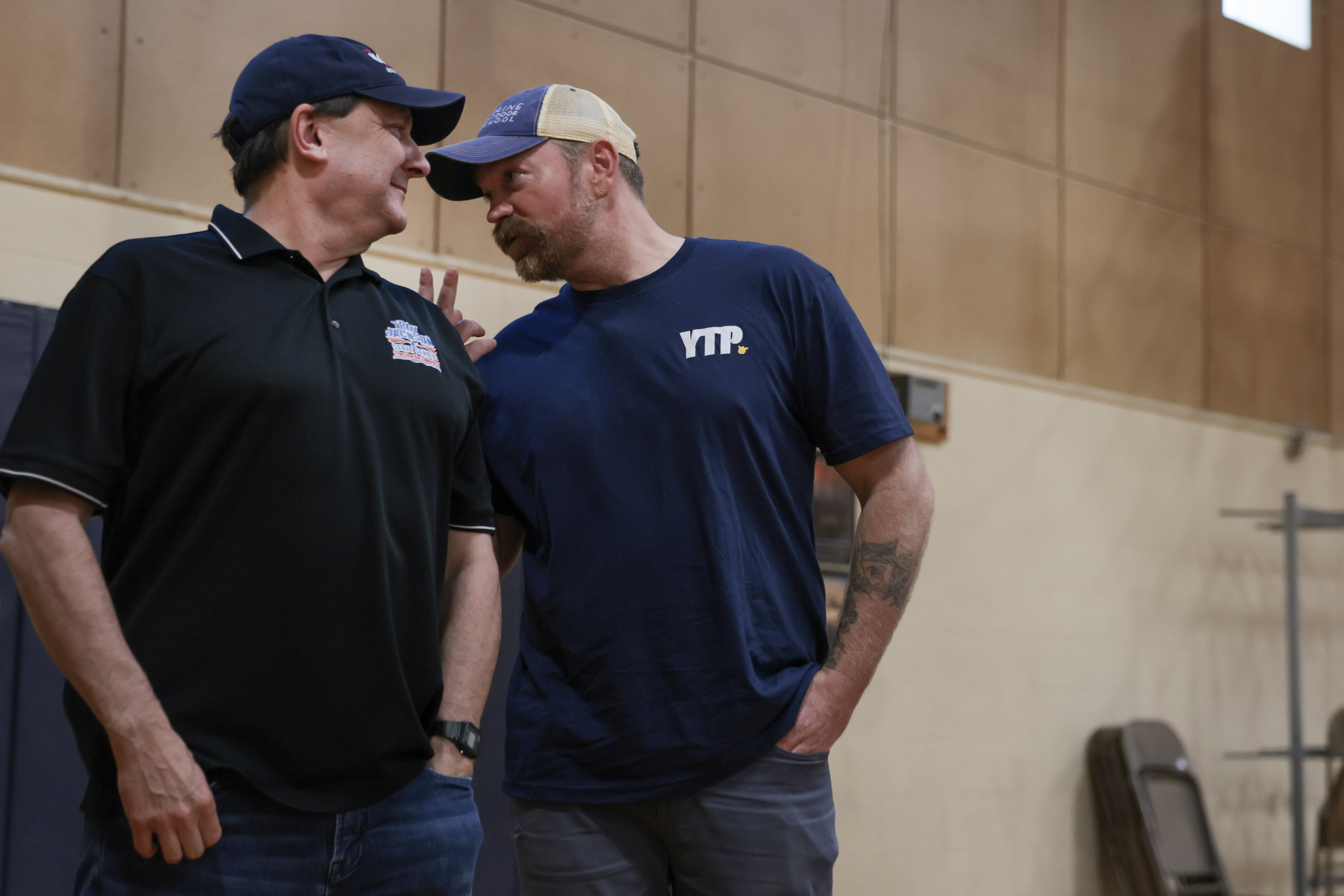 Democratic U.S. Senate candidate Graham Platner stands with Troy Jackson, who is running for Governor of Maine, during a town hall about a Vision for a Healthy Society on May 20, 2026 in Portland,...