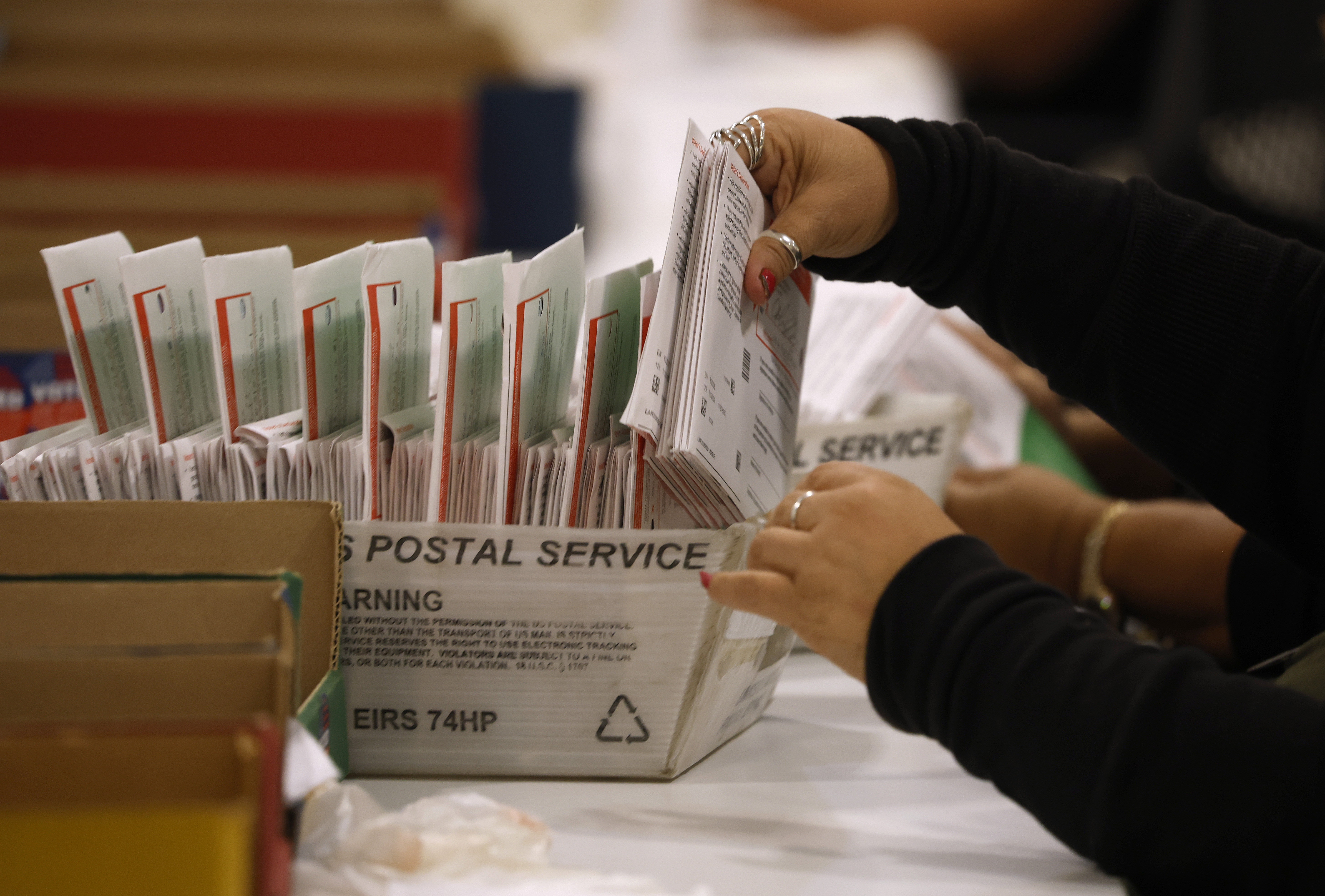 CITY OF INDUSTRY, CALIFORNIA - JUNE 05: An election worker processes mail-in ballots for the California state primary election at the Los Angeles County Ballot Processing Center on June 05, 2026 in City of Industry, California. The U.S. Department of Justice sent a federal prosecutor to observe ballot counting in Los Angeles County after President Donald Trump alleged, without evidence, that delays in counting ballots were the result of election fraud. (Photo by Justin Sullivan/Getty Images)