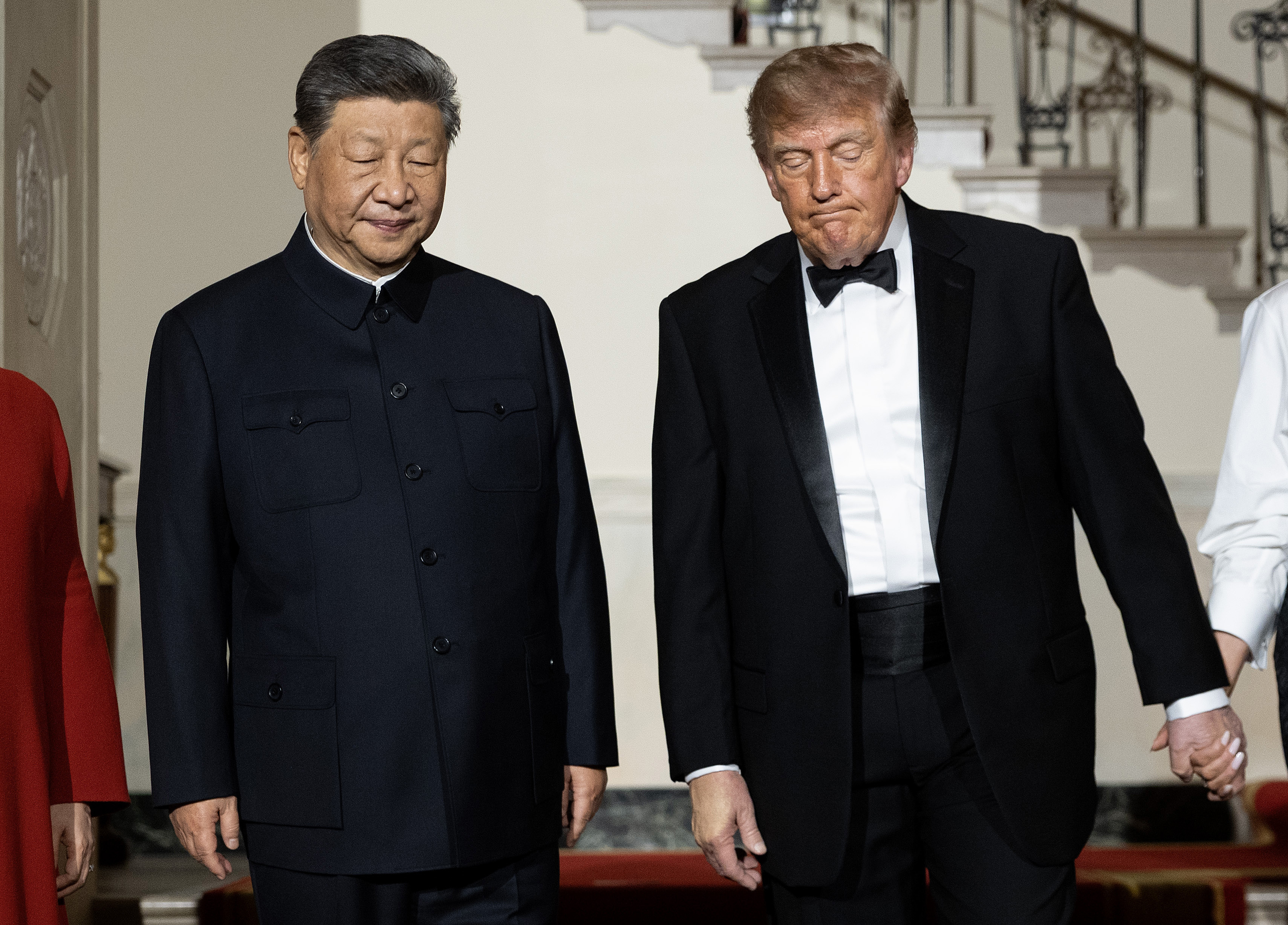 Chinese President Xi Jinping (L) and U.S. President Donald Trump descend the grand staircase before a state dinner in the East Room of the White House on September 24, 2026 in Washington, DC. Trump is hosting Xi for a three-day state visit to Washington, DC, where the leaders were expected to discuss trade practices, artificial intelligence and the furthering of
