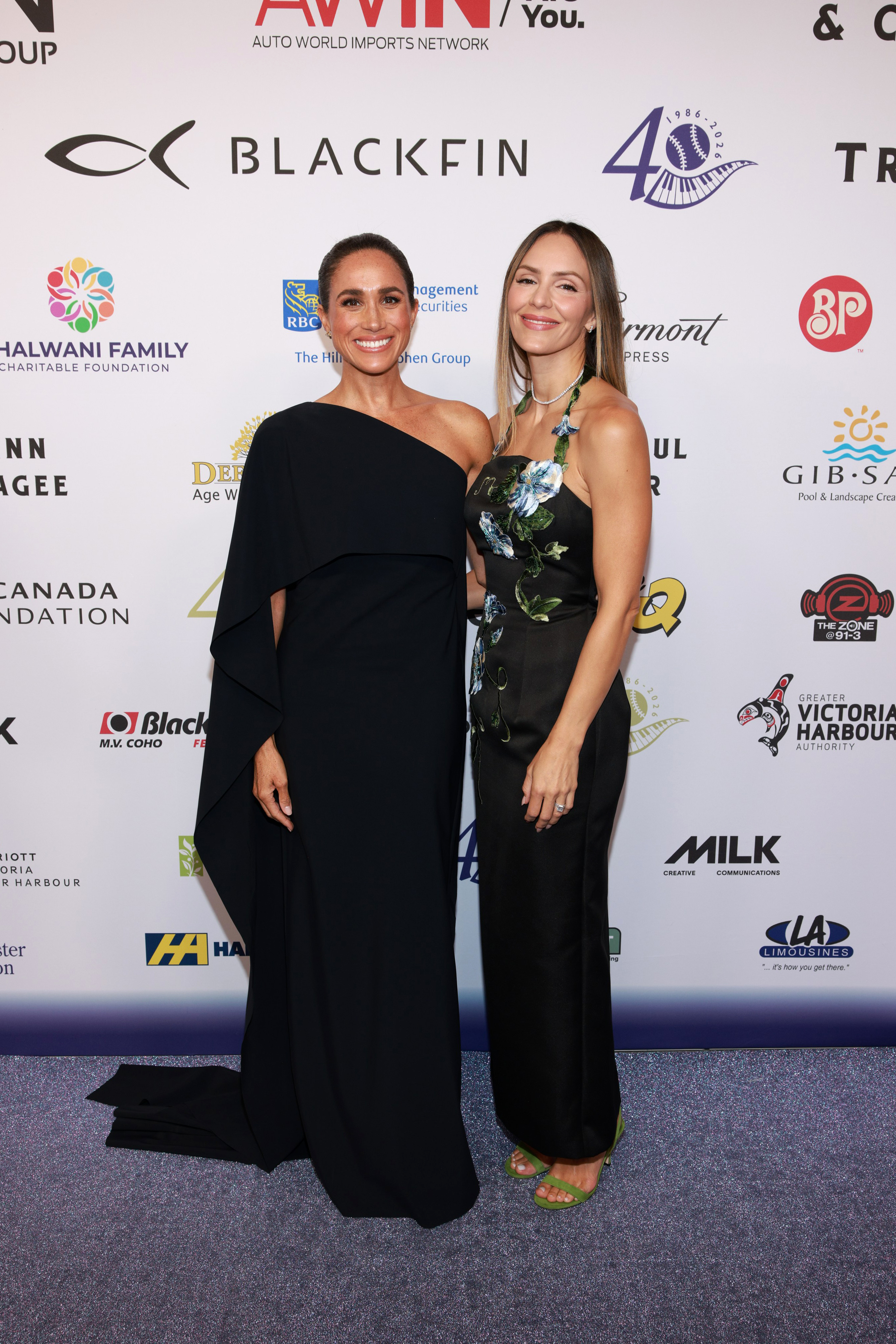 VICTORIA, BRITISH COLUMBIA - AUGUST 07: Meghan, Duchess of Sussex (L) and Katharine McPhee attend the David Foster Foundation 40th Anniversary Celebration on August 07, 2026 in Victoria, British Columbia. (Photo by Vito Amati/The David Foster Foundation via Getty Images)