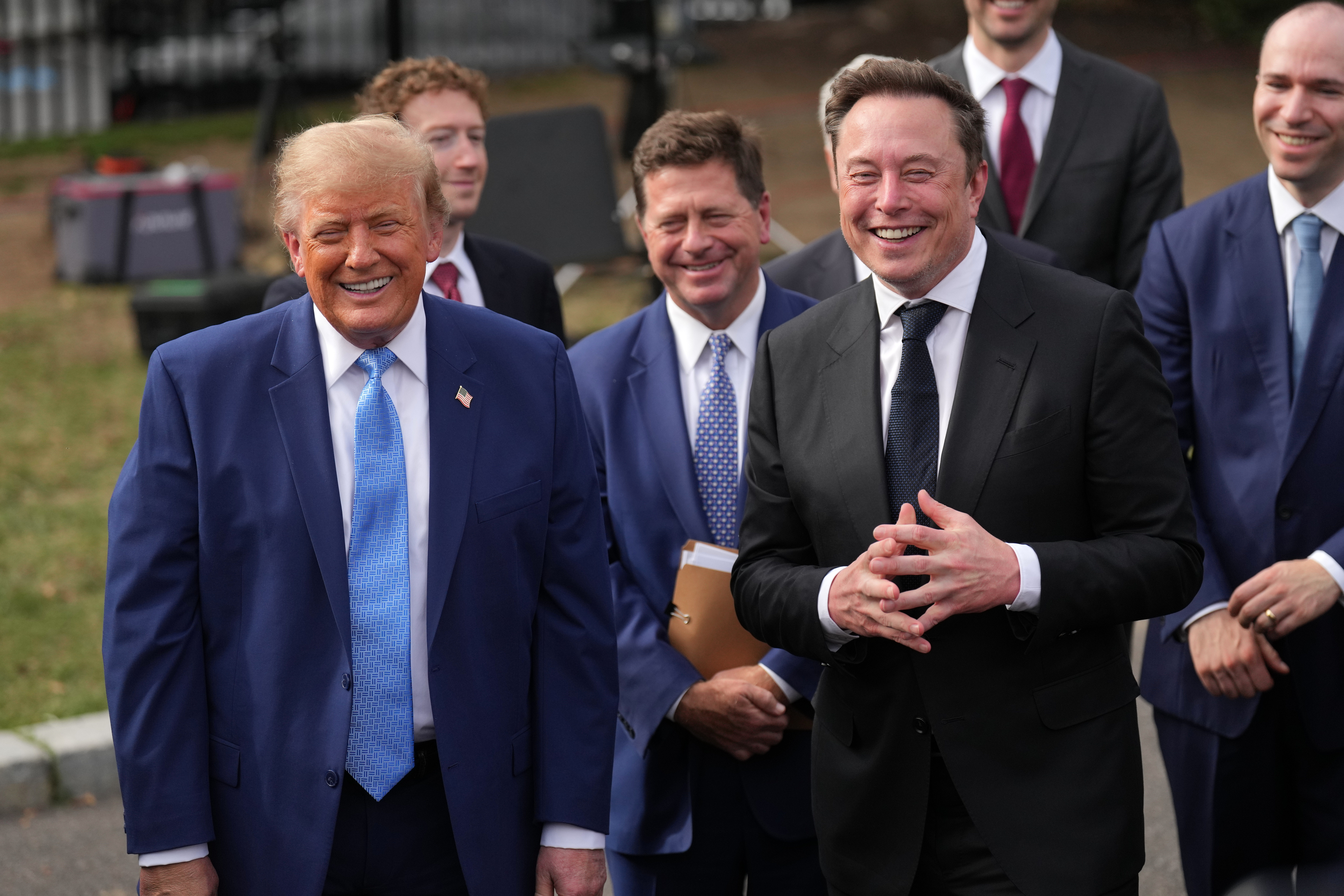 President Donald Trump smiles as Elon Musk speaks to reporters at the White House in Washington, Tuesday Sept. 29, 2026, after meeting with top executives of AI firms. (AP Photo/Jacquelyn Martin)