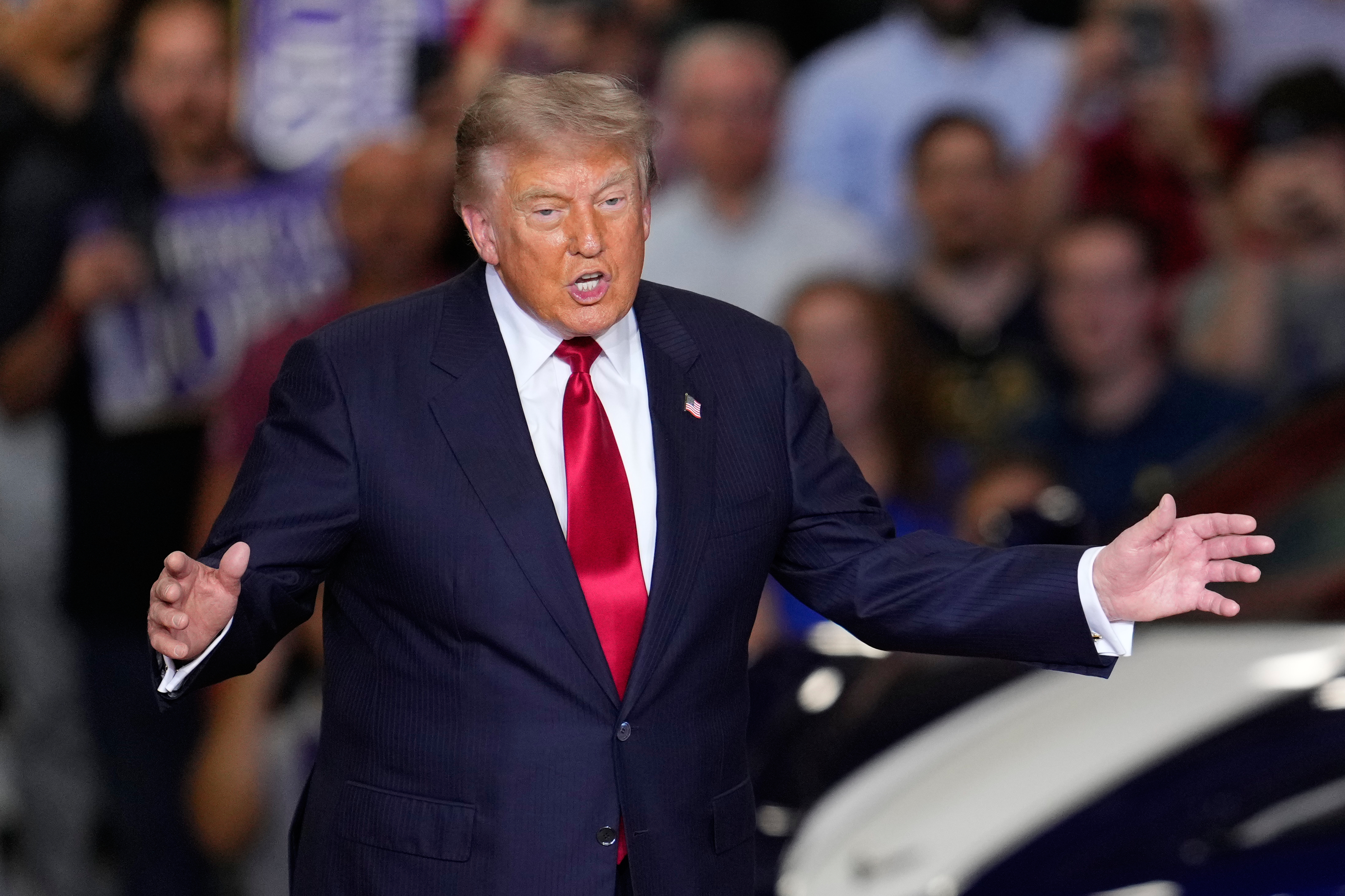 President Donald Trump arrives to speak at an event at the General Motors Proving Ground Monday, July 27, 2026, in Milford, Mich. (AP Photo/Paul Sancya)
