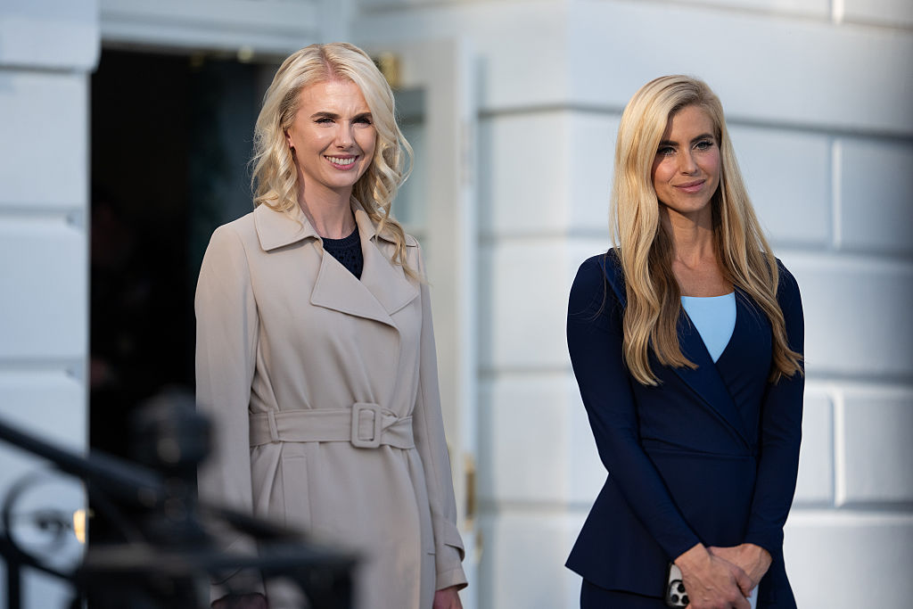WASHINGTON, DC - OCTOBER 12: Executive Assistant to the President Natalie Harp stands with White House Press Secretary Katie Zacharia on the South Lawn as they depart the White House on October 12, 2026 in Washington, DC. President Trump is headed to Ohio for a rally with Republican candidates with 22 days to go until the midterm elections. (Photo by Aaron Schwartz/Getty Images)