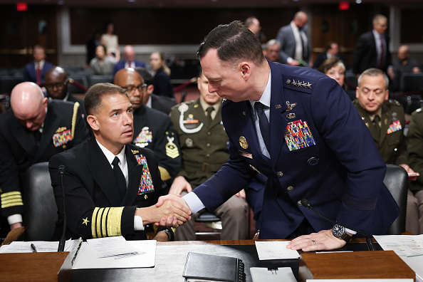 WASHINGTON, DC - MAY 14:  Commander of U.S. Africa Command (AFRICOM) Air Force Gen. Dagvin Anderson (R) shakes hands with Commander of U.S. Central Command (CENTCOM) Navy Adm. Brad Cooper (L) as they conclude their testimony before the Senate Armed Services Committee in the Dirksen Senate Office Building on Capitol Hill on May 14, 2026 in Washington, DC. The full committee heard testimony on