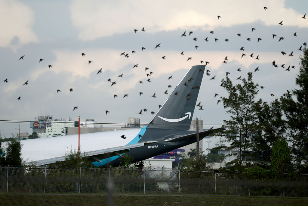 MIAMI, FLORIDA - SEPTEMBER 06:   An Amazon cargo plane is seen after it crashed at Miami International Airport on September 06, 2026 in Miami, Florida. In a statement, the Federal Aviation Administration said Prime Air Flight 7598 overran the runway while landing around 2 p.m. after departing from Luis Muñoz Marín International Airport in San Juan, Puerto Rico, earlier today. (Photo by Joe Raedle/Getty Images)