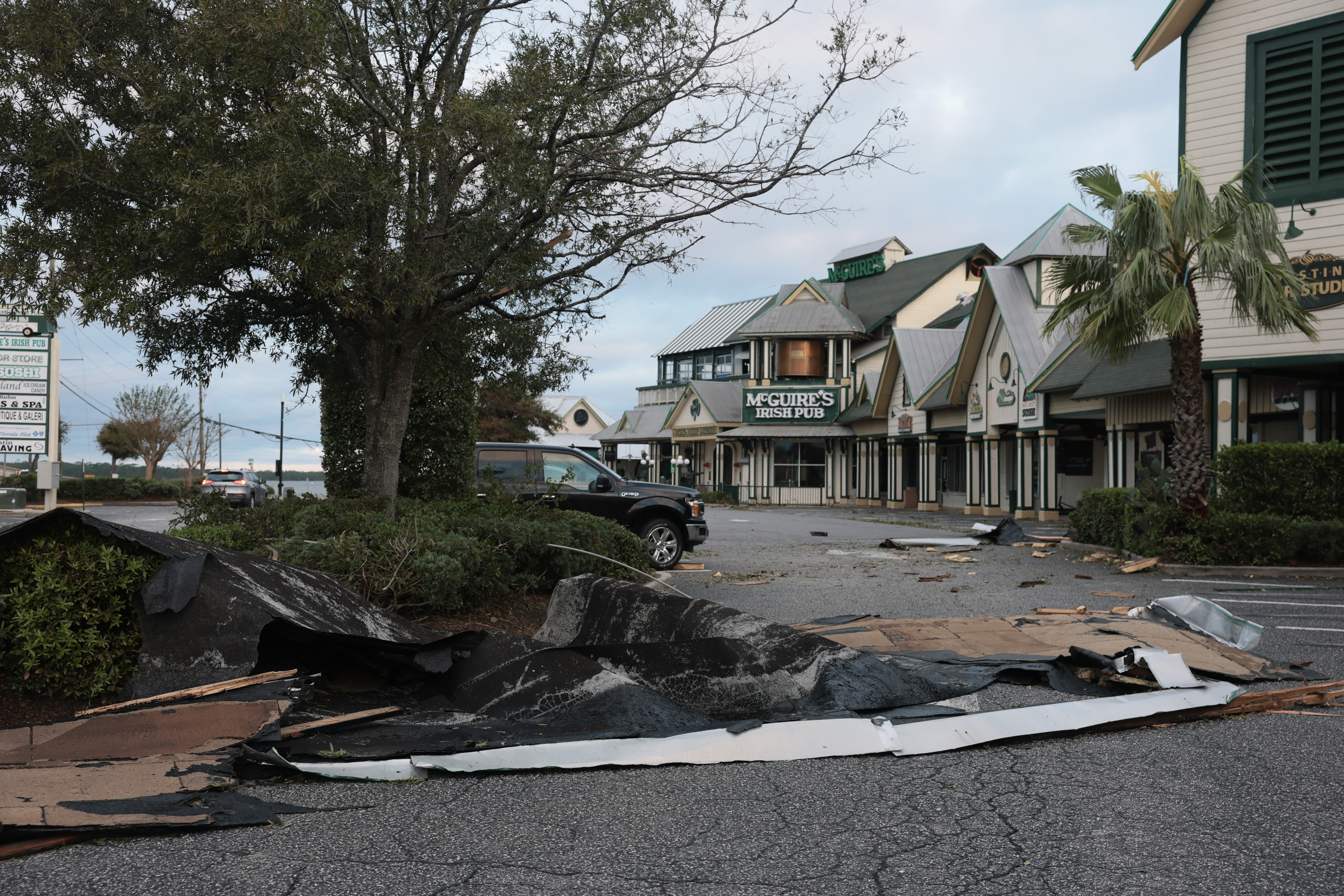 DESTIN, FLORIDA - OCTOBER 10: Roofing material lies on the ground after Hurricane Isaias tore it off as it passed through the area on October 10, 2026, in Destin, Florida. Hurricane Isaias made landfall as the season's first Atlantic hurricane with category two winds. (Photo by Joe Raedle/Getty Images)