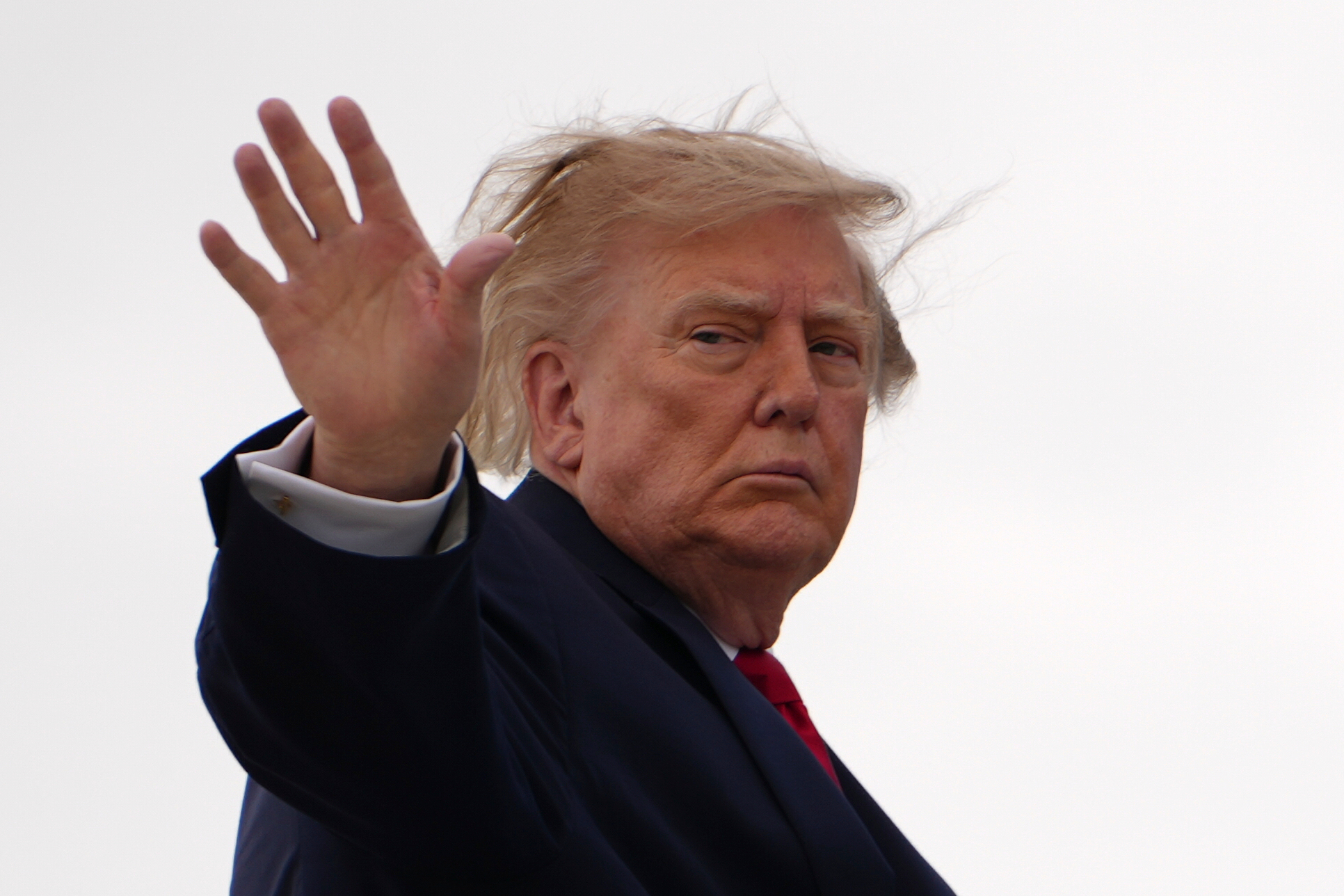 President Donald Trump waves as he boards Air Force One, Saturday, Sept. 26, 2026, at Joint Base Andrews, Md. (AP Photo/Julia Demaree Nikhinson)